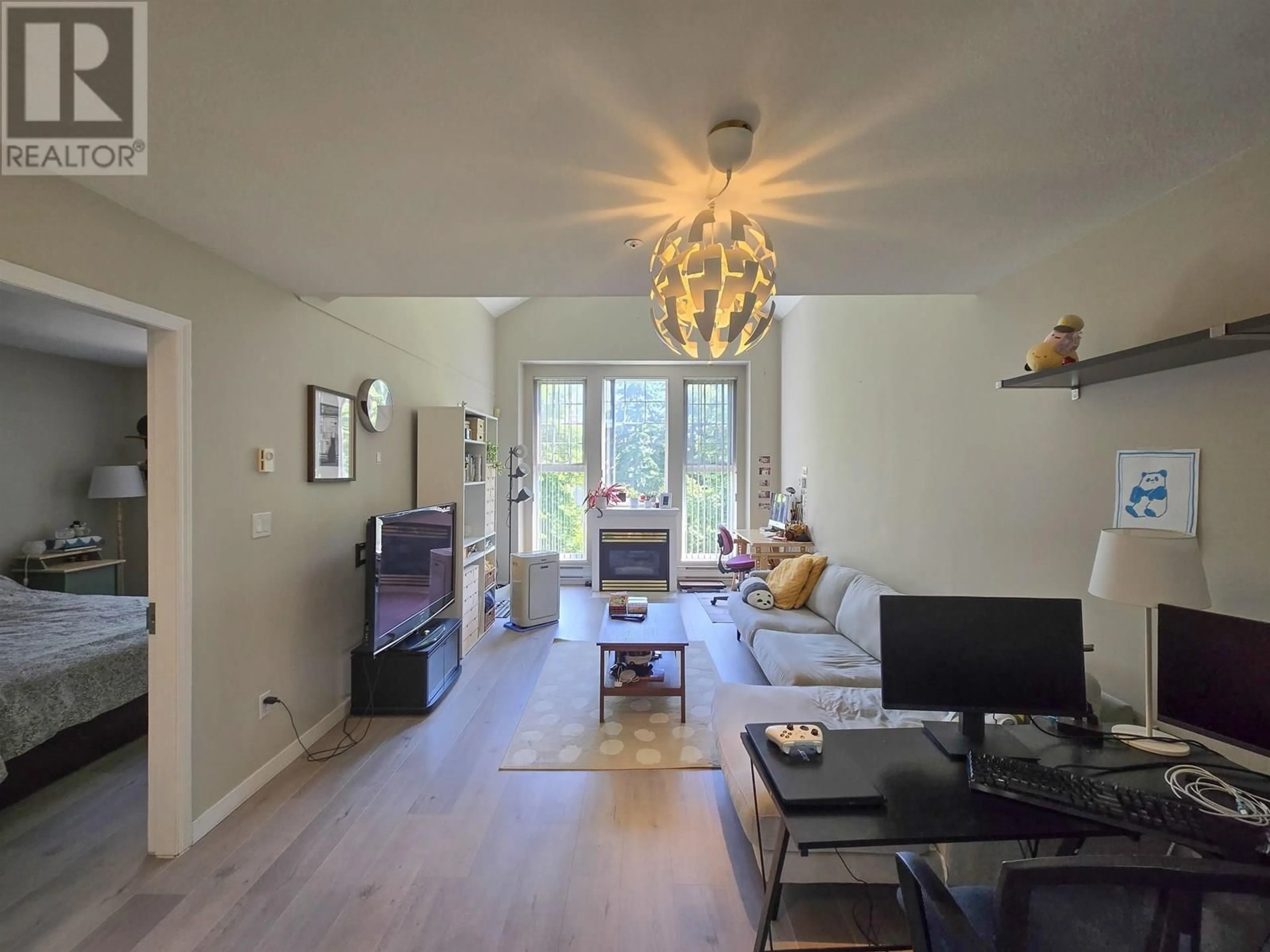 Living room with furniture, wood/laminate floor for 406 - 1190 EASTWOOD STREET, Coquitlam British Columbia V3B7S1