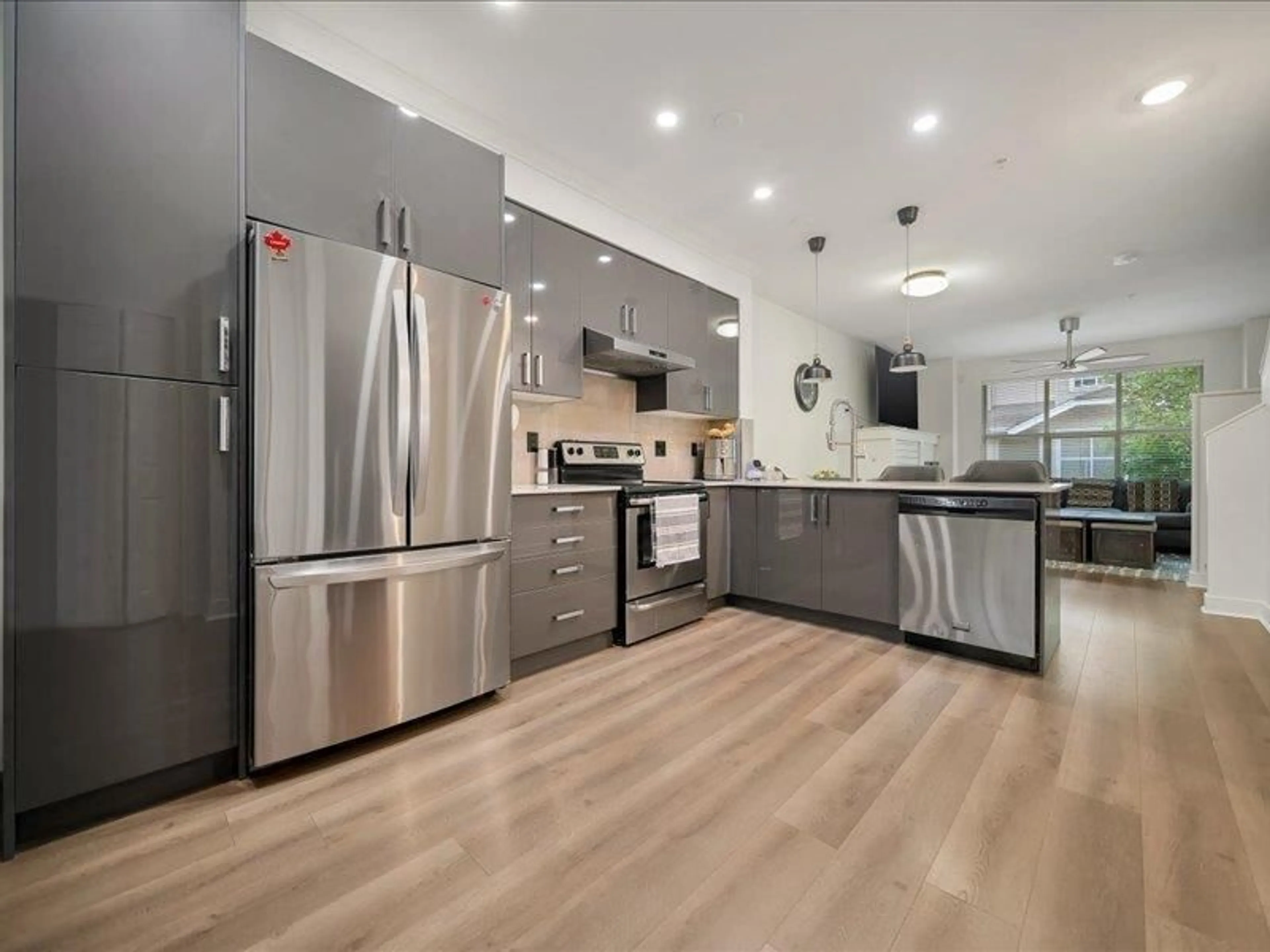 Open concept kitchen, wood/laminate floor for 8 - 20460 66, Langley British Columbia V2Y3B6