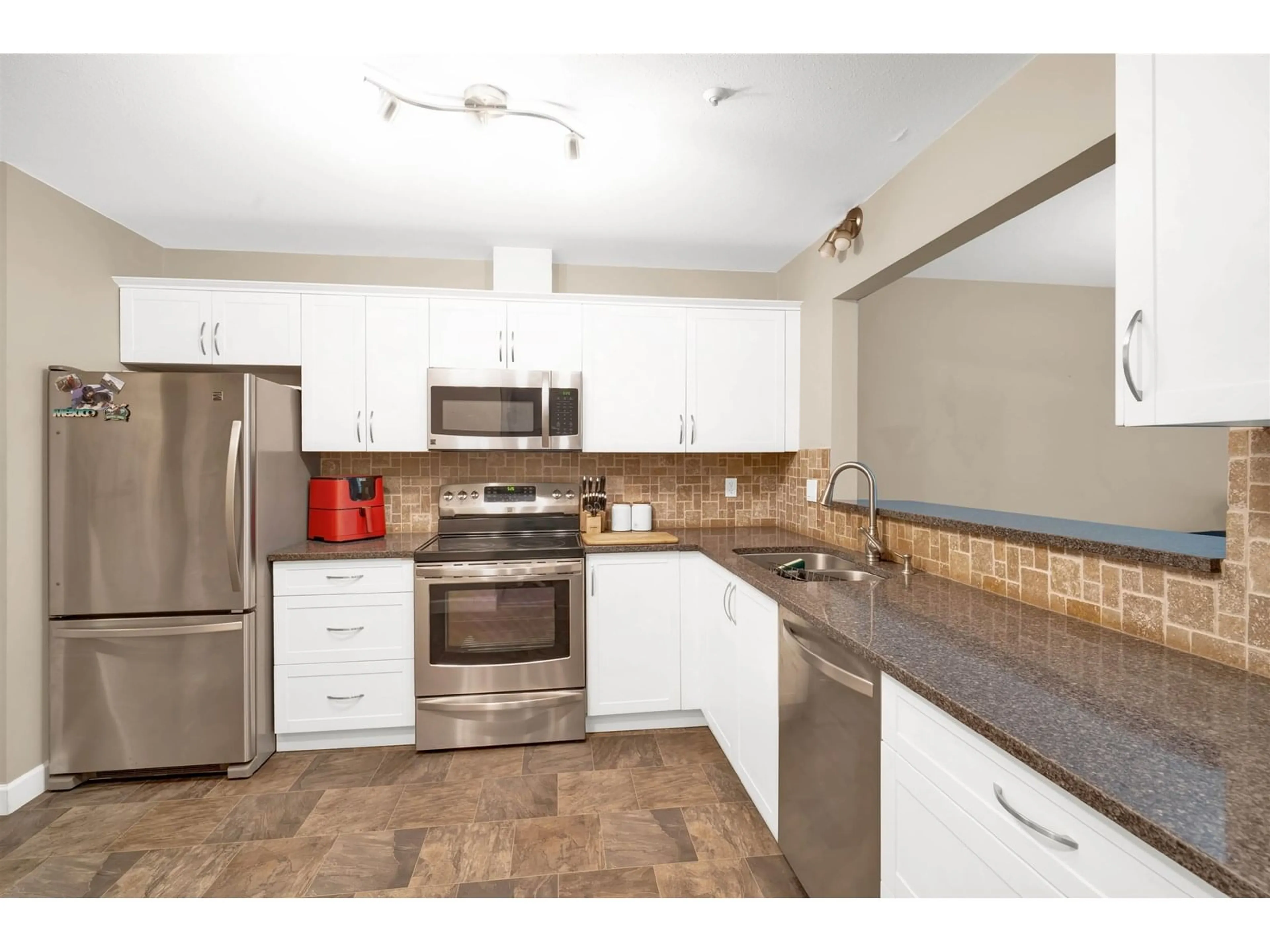 Standard kitchen, ceramic/tile floor for 107 - 5909 177B, Surrey British Columbia V3S4J7
