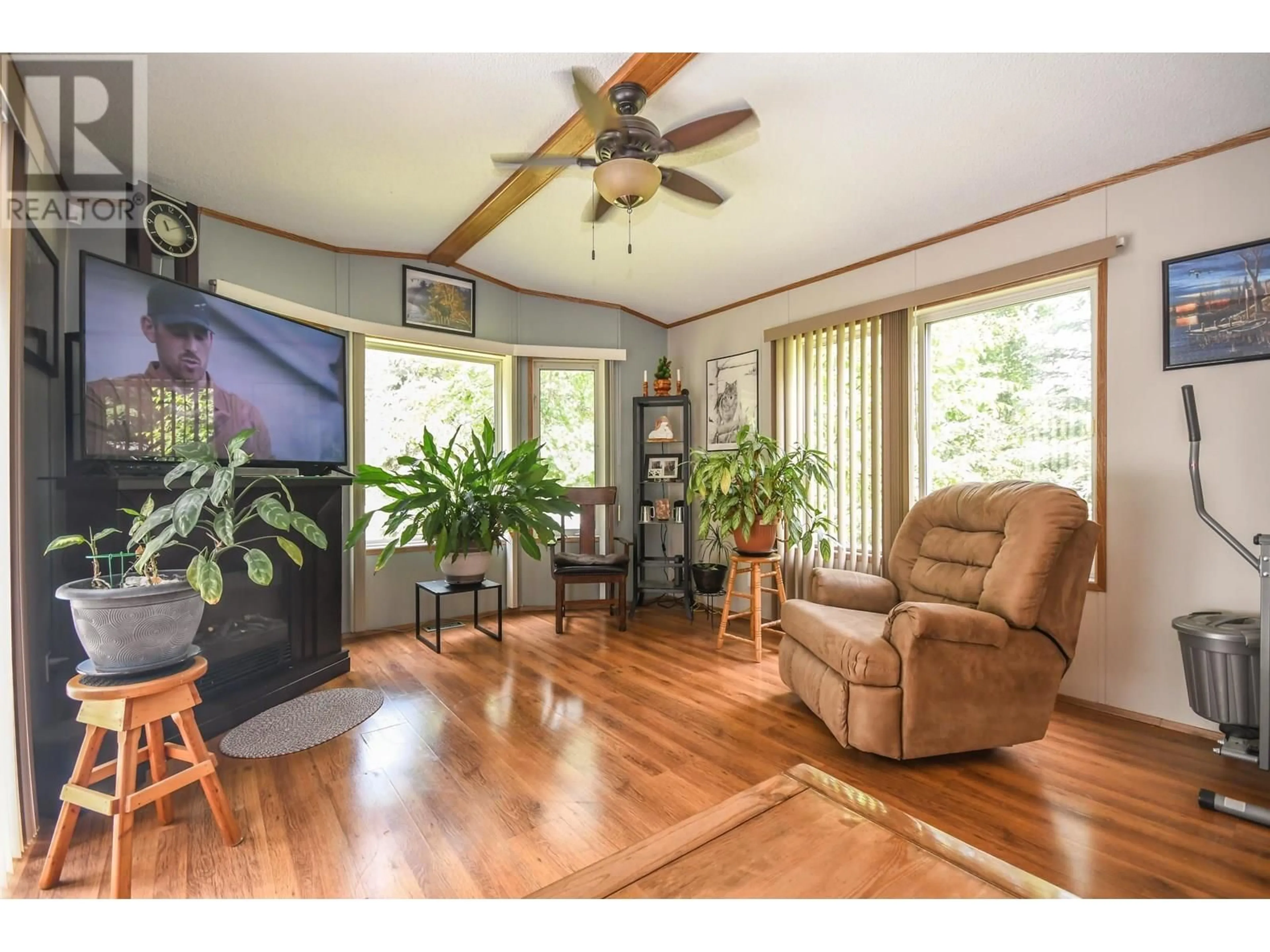 Living room with furniture, wood/laminate floor for 2925 MINOTTI DRIVE, Prince George British Columbia V2K3S6