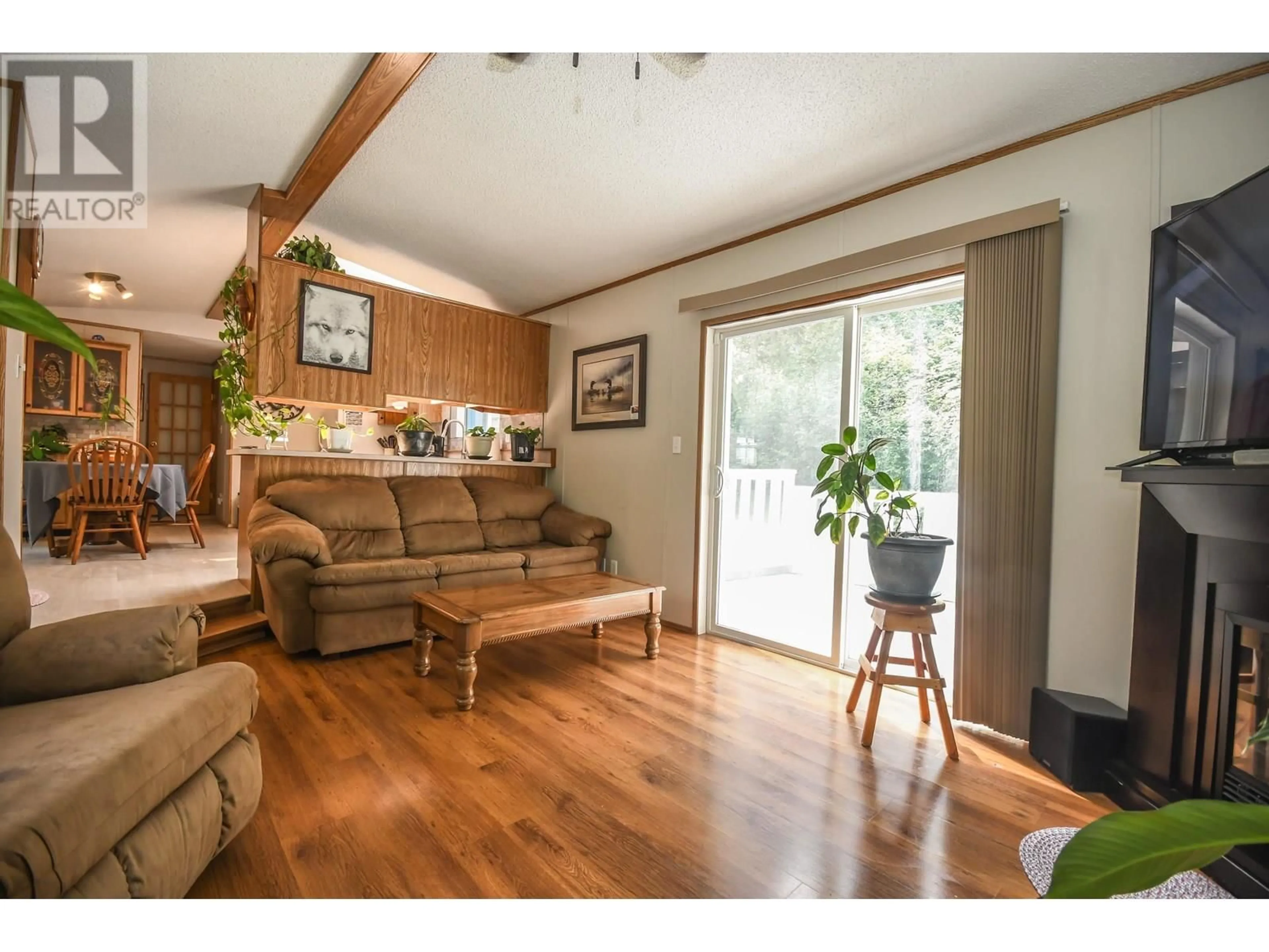 Living room with furniture, wood/laminate floor for 2925 MINOTTI DRIVE, Prince George British Columbia V2K3S6
