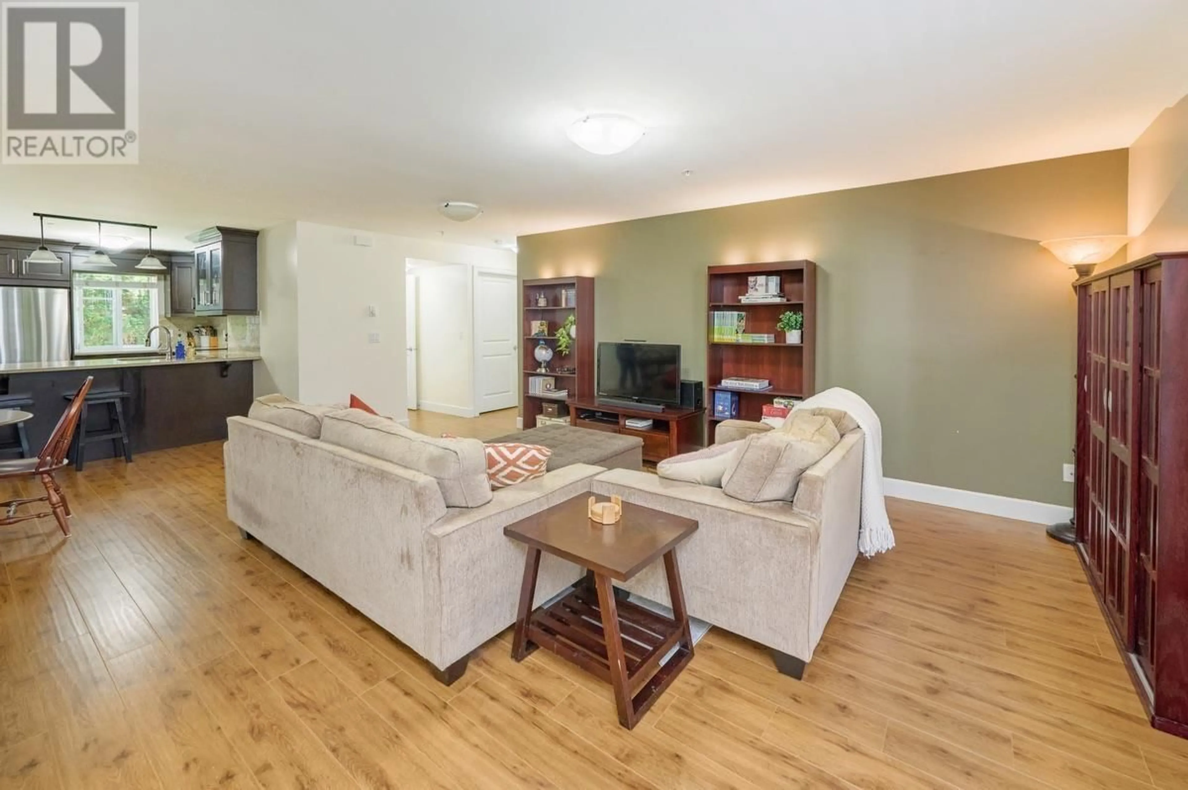 Living room with furniture, wood/laminate floor for 103 - 423 EIGHTH STREET, New Westminster British Columbia V3M3R5