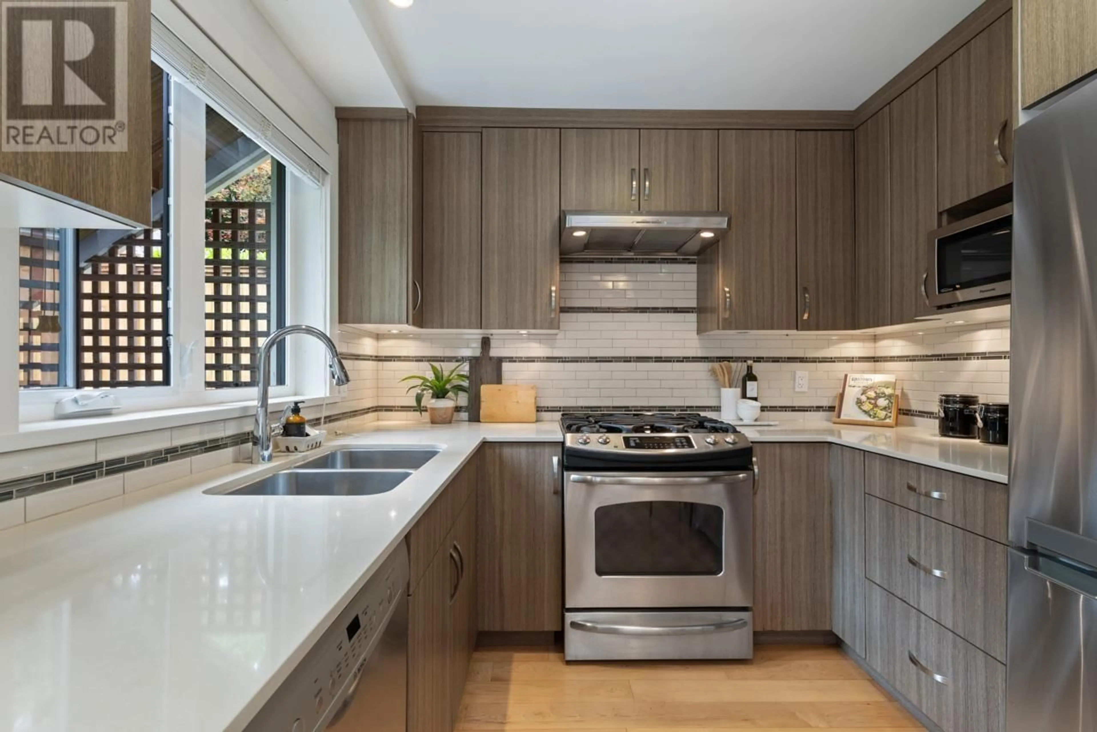 Contemporary kitchen, ceramic/tile floor for 1963 13TH AVENUE, Vancouver British Columbia V6J2H5