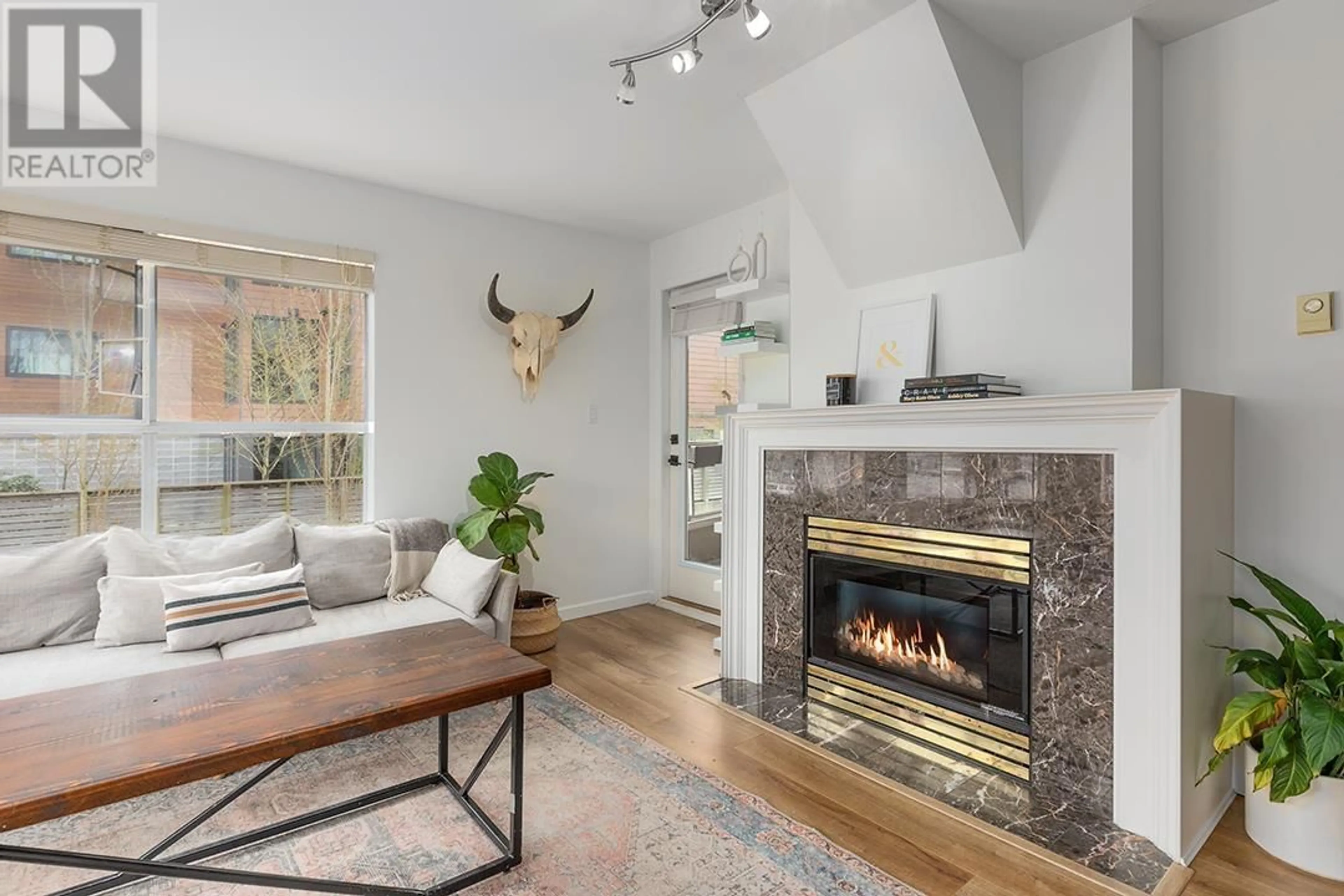 Living room with furniture, unknown for 208 - 2285 PITT RIVER ROAD, Port Coquitlam British Columbia V3C1R7