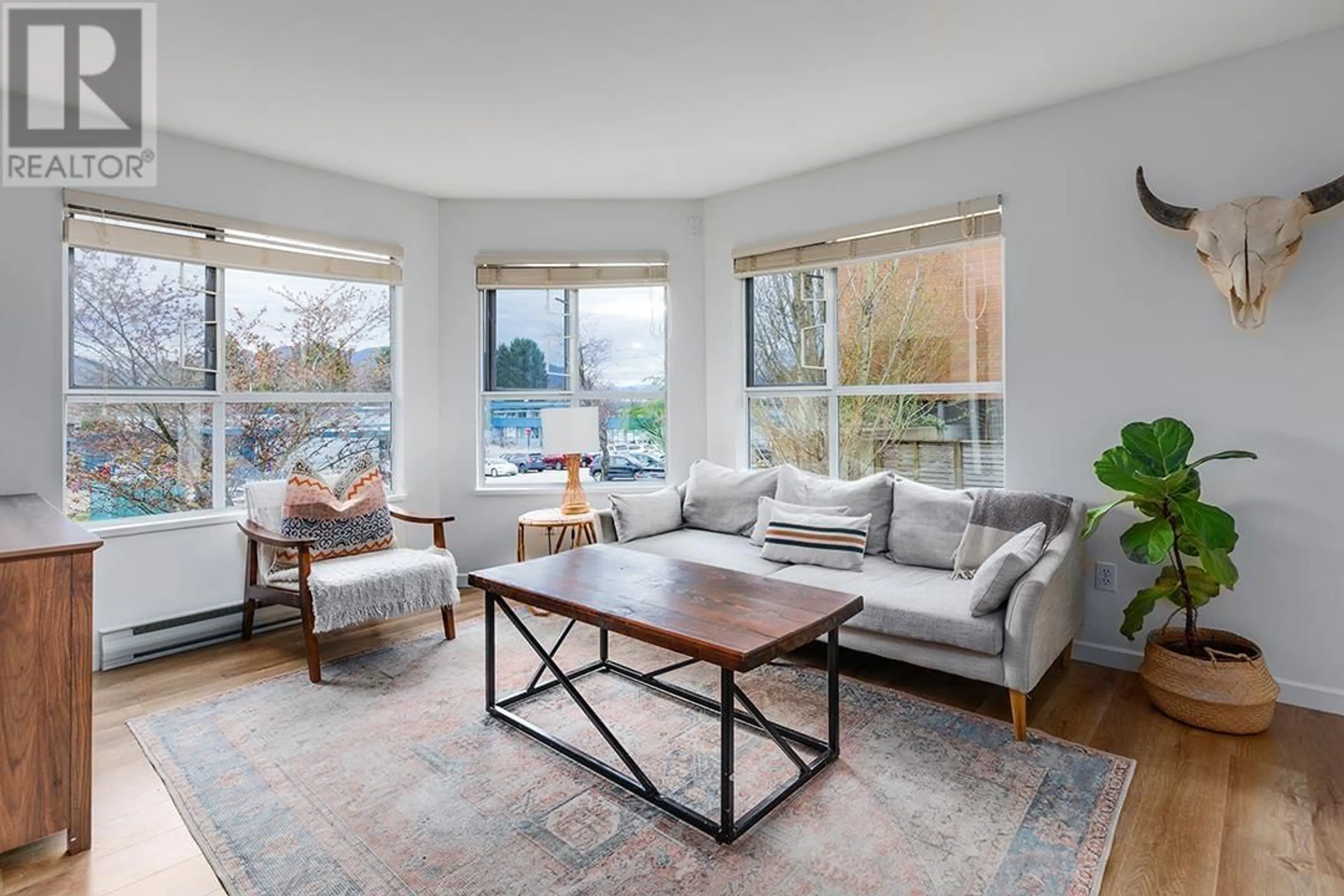 Living room with furniture, unknown for 208 - 2285 PITT RIVER ROAD, Port Coquitlam British Columbia V3C1R7