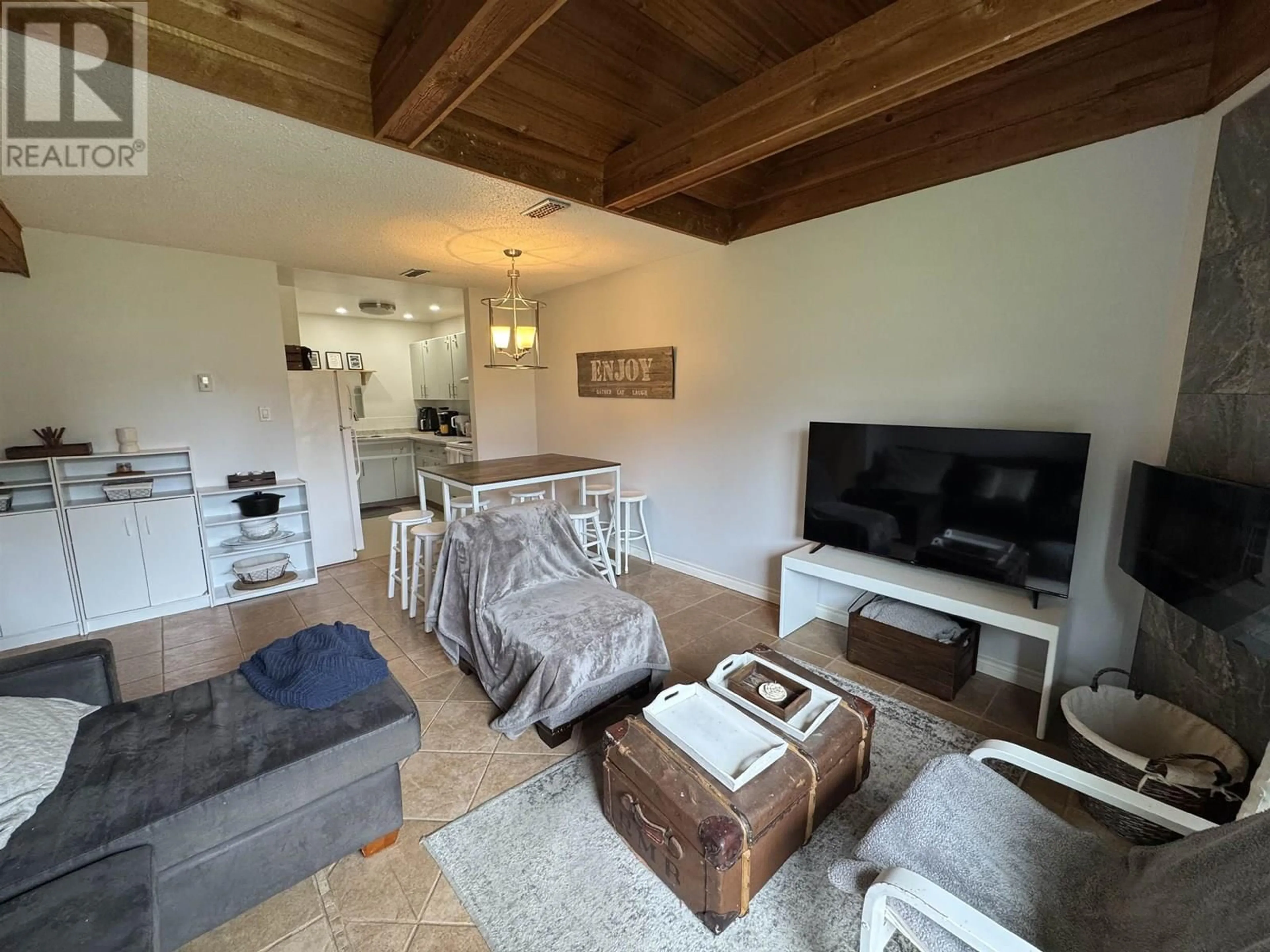 Living room with furniture, wood/laminate floor for 24 - 800 SECOND AVENUE, Williams Lake British Columbia V2G4C4