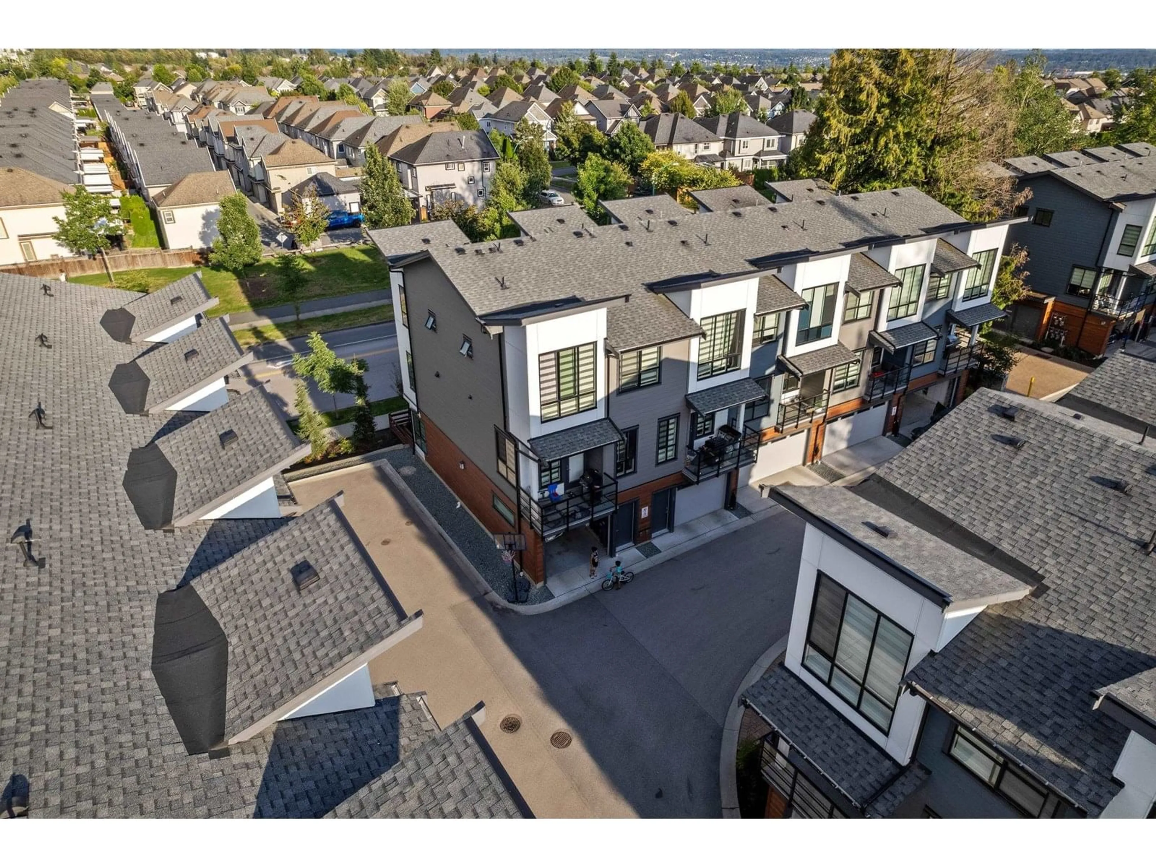 A pic from outside/outdoor area/front of a property/back of a property/a pic from drone, street for 10 - 7177 194A, Surrey British Columbia V4N6V6