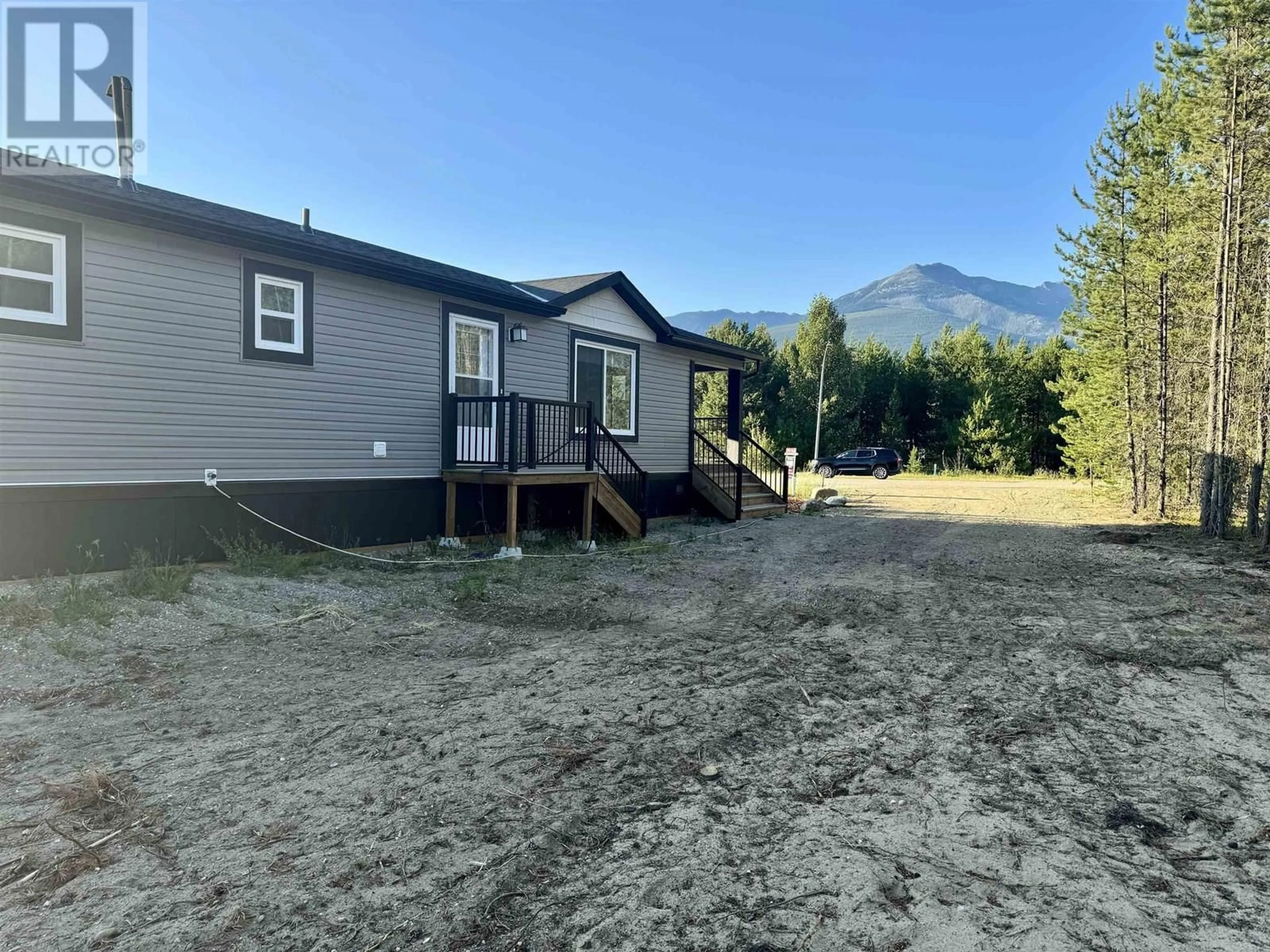 A pic from outside/outdoor area/front of a property/back of a property/a pic from drone, mountain view for 1471 8TH PLACE, Valemount British Columbia V0E2Z0