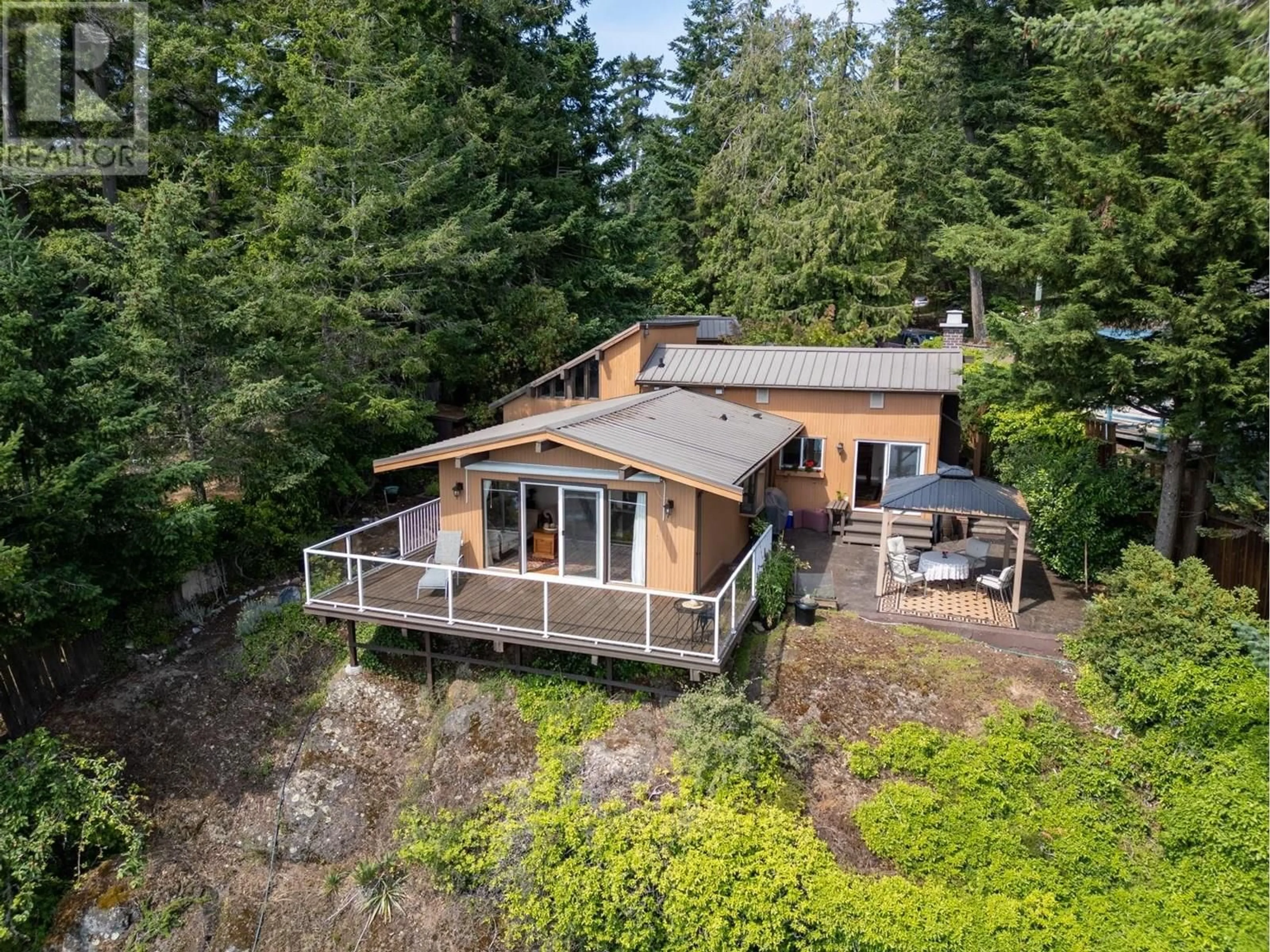 A pic from outside/outdoor area/front of a property/back of a property/a pic from drone, water/lake/river/ocean view for 4843 CUTLASS COURT, Pender Island British Columbia V0N2M2