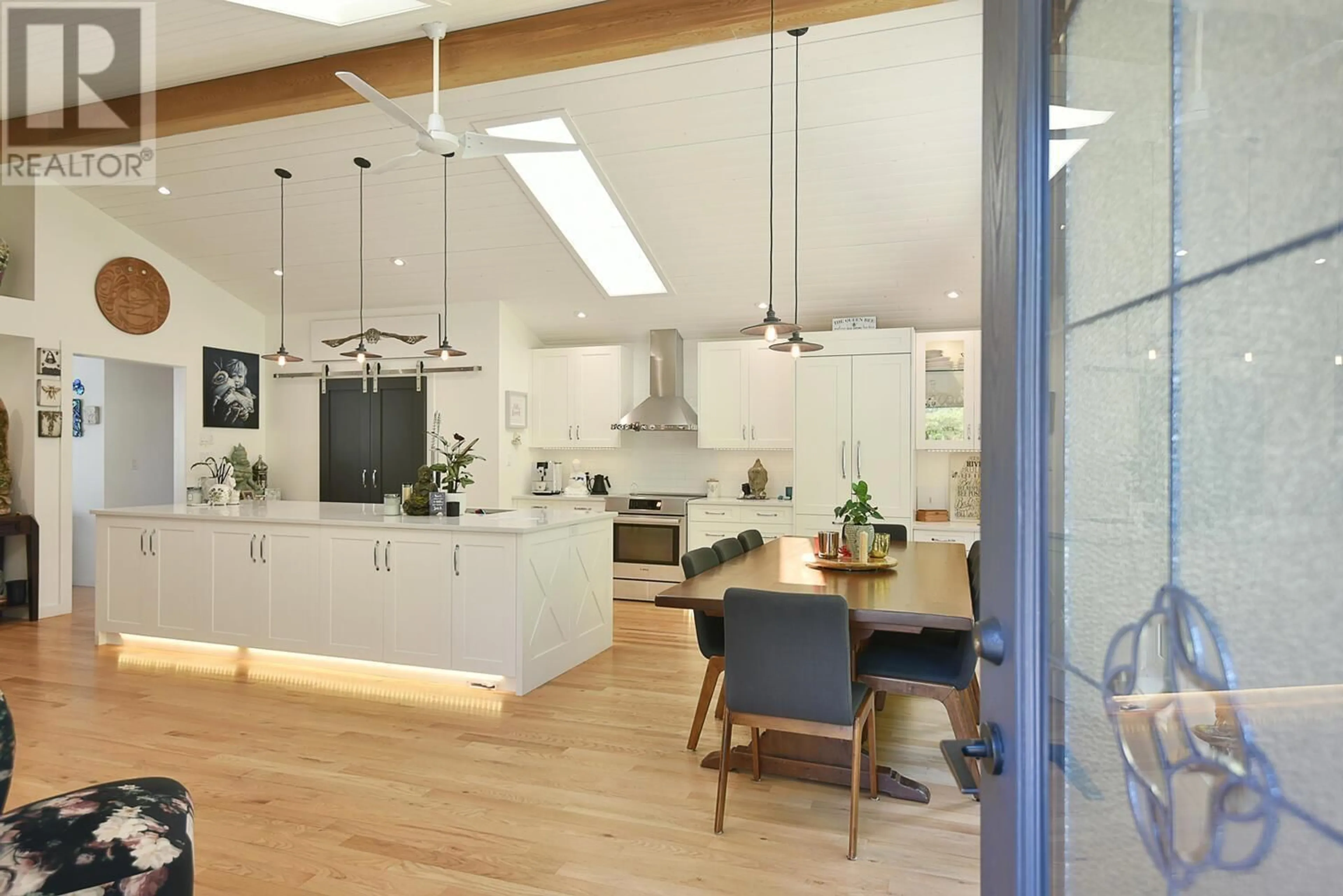 Open concept kitchen, wood/laminate floor for 2855 LACEY PLACE, Roberts Creek British Columbia V0N2W4