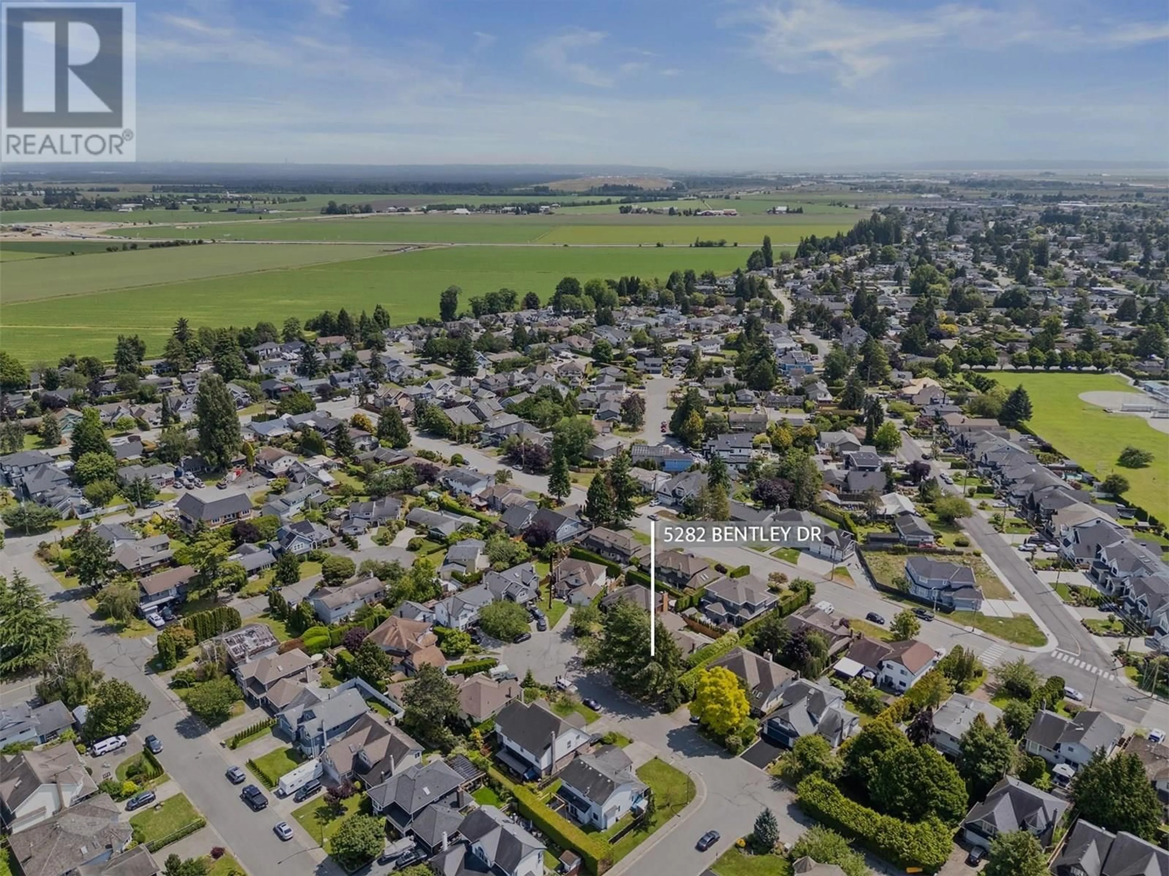 A pic from outside/outdoor area/front of a property/back of a property/a pic from drone, street for 5282 BENTLEY DRIVE, Ladner British Columbia V4K4J3