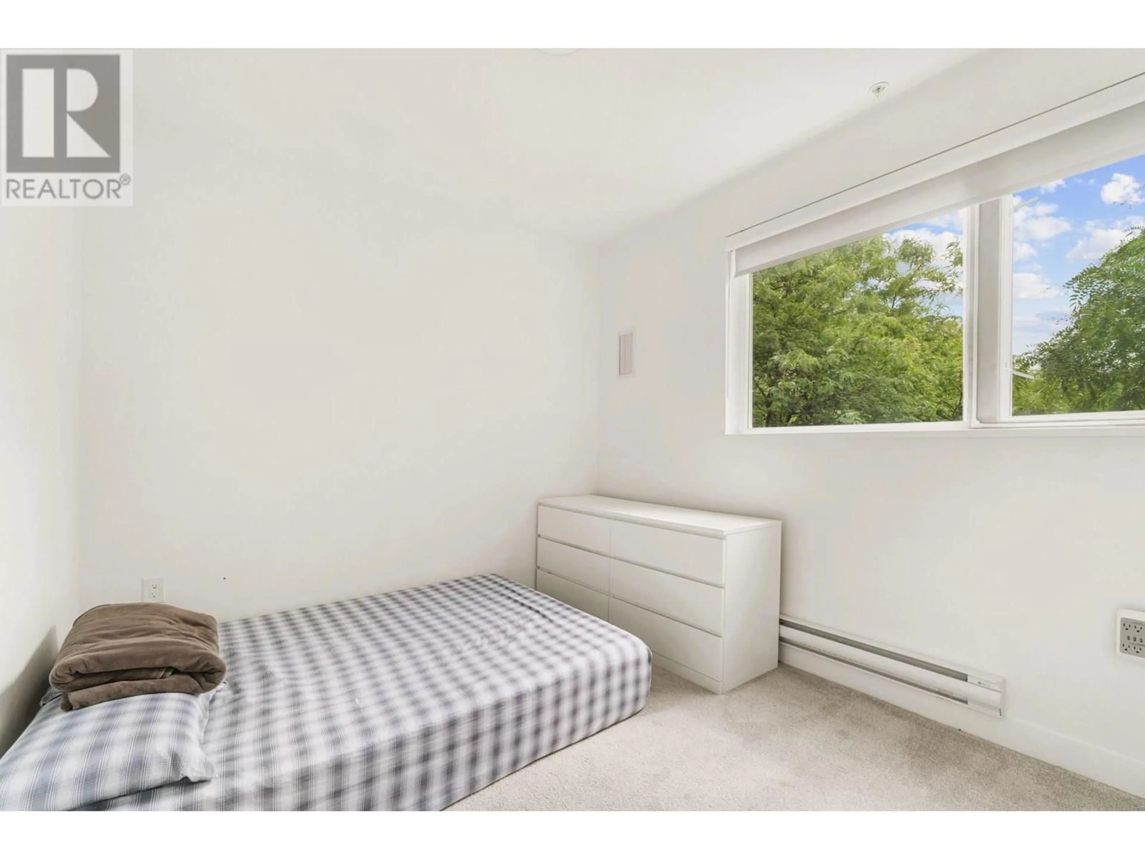 Bedroom with bed, unknown for 206 - 2688 DUKE STREET, Vancouver British Columbia V5R4S9