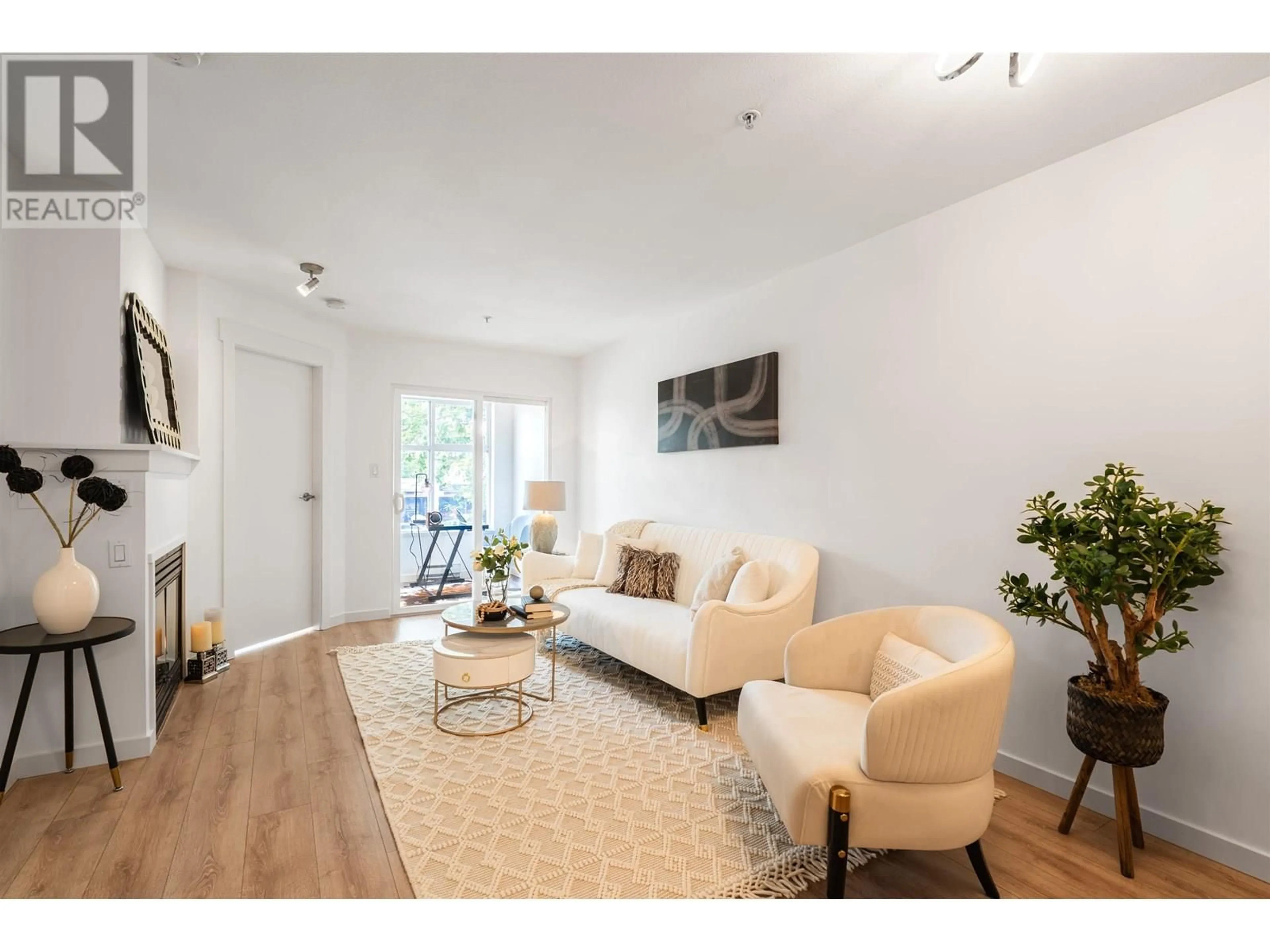 Living room with furniture, wood/laminate floor for 209 - 1503 65TH AVENUE, Vancouver British Columbia V6P6Y8
