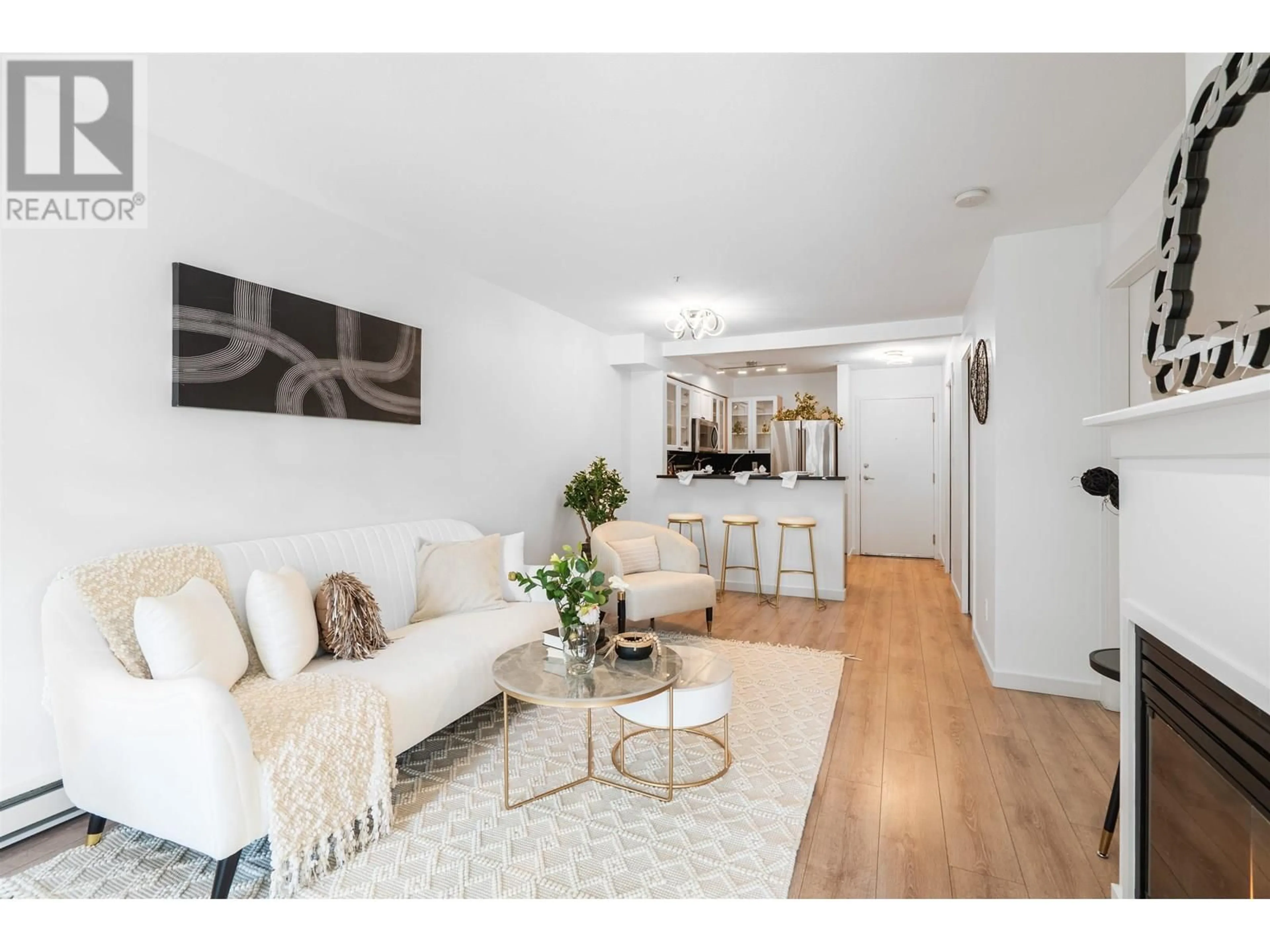 Living room with furniture, wood/laminate floor for 209 - 1503 65TH AVENUE, Vancouver British Columbia V6P6Y8