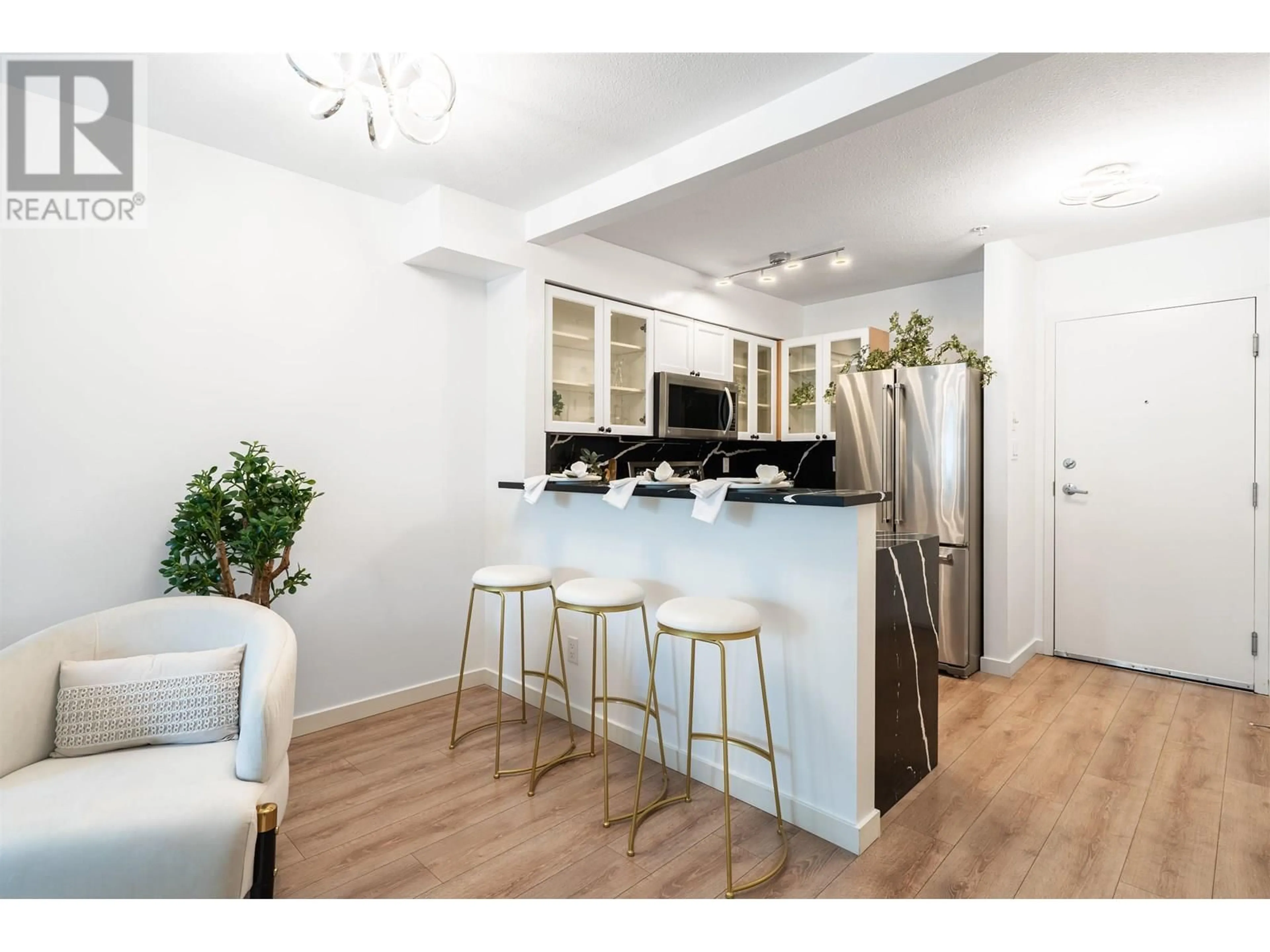 Open concept kitchen, wood/laminate floor for 209 - 1503 65TH AVENUE, Vancouver British Columbia V6P6Y8