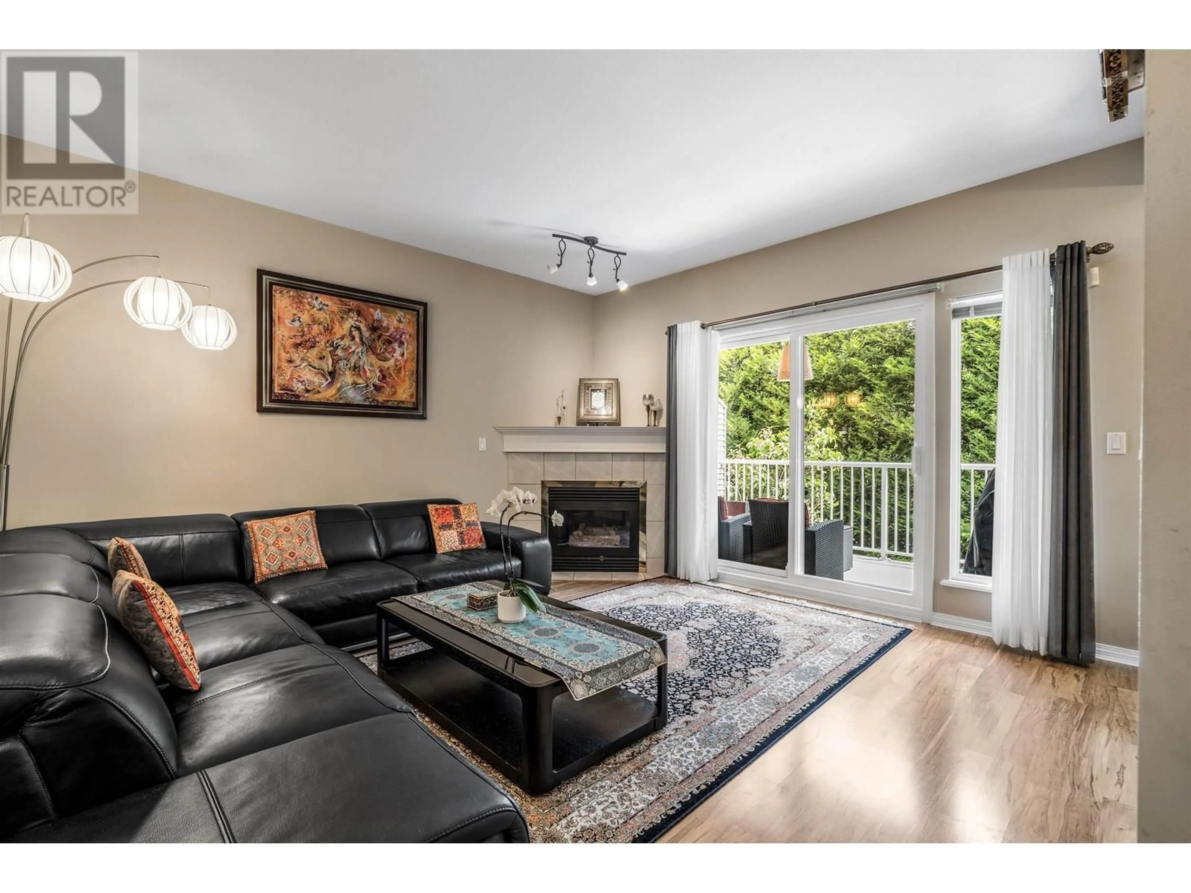 Living room with furniture, wood/laminate floor for 19 - 1765 PADDOCK DRIVE, Coquitlam British Columbia V3E3J1