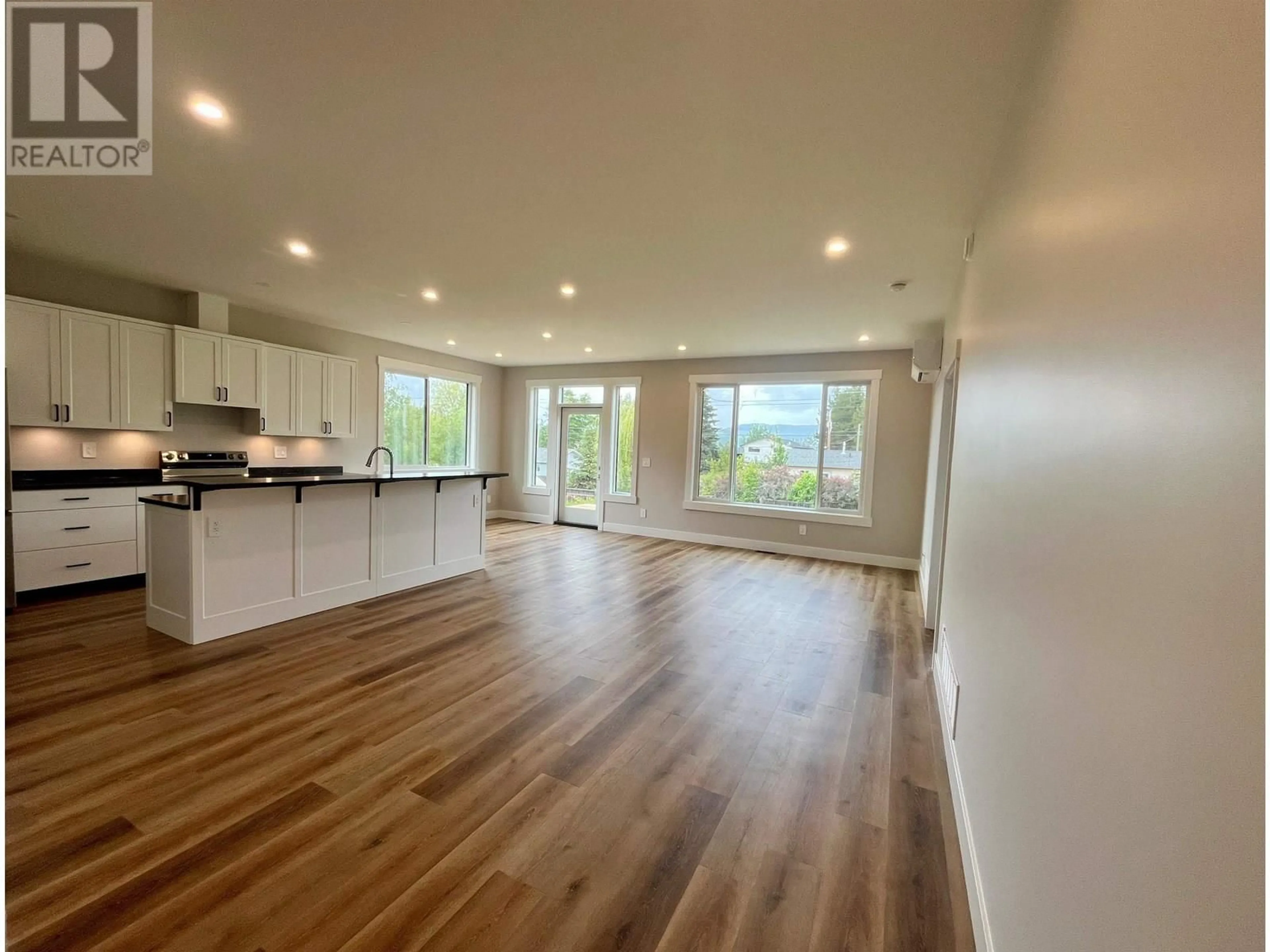 Open concept kitchen, wood/laminate floor for 1661 TELEGRAPH STREET, Telkwa British Columbia V0J2X0