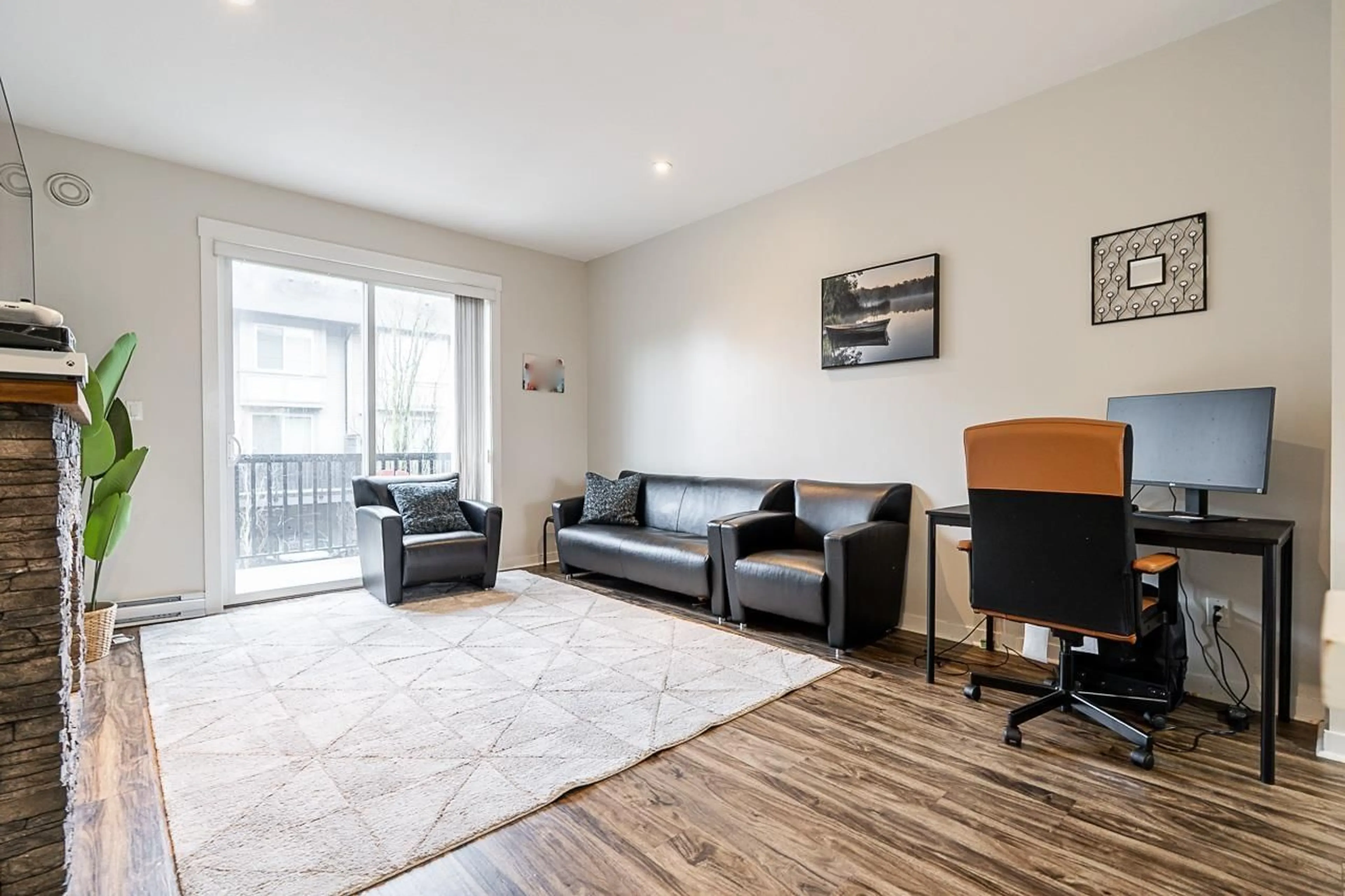 Living room with furniture, wood/laminate floor for 57 - 6450 187, Surrey British Columbia V3S2X4