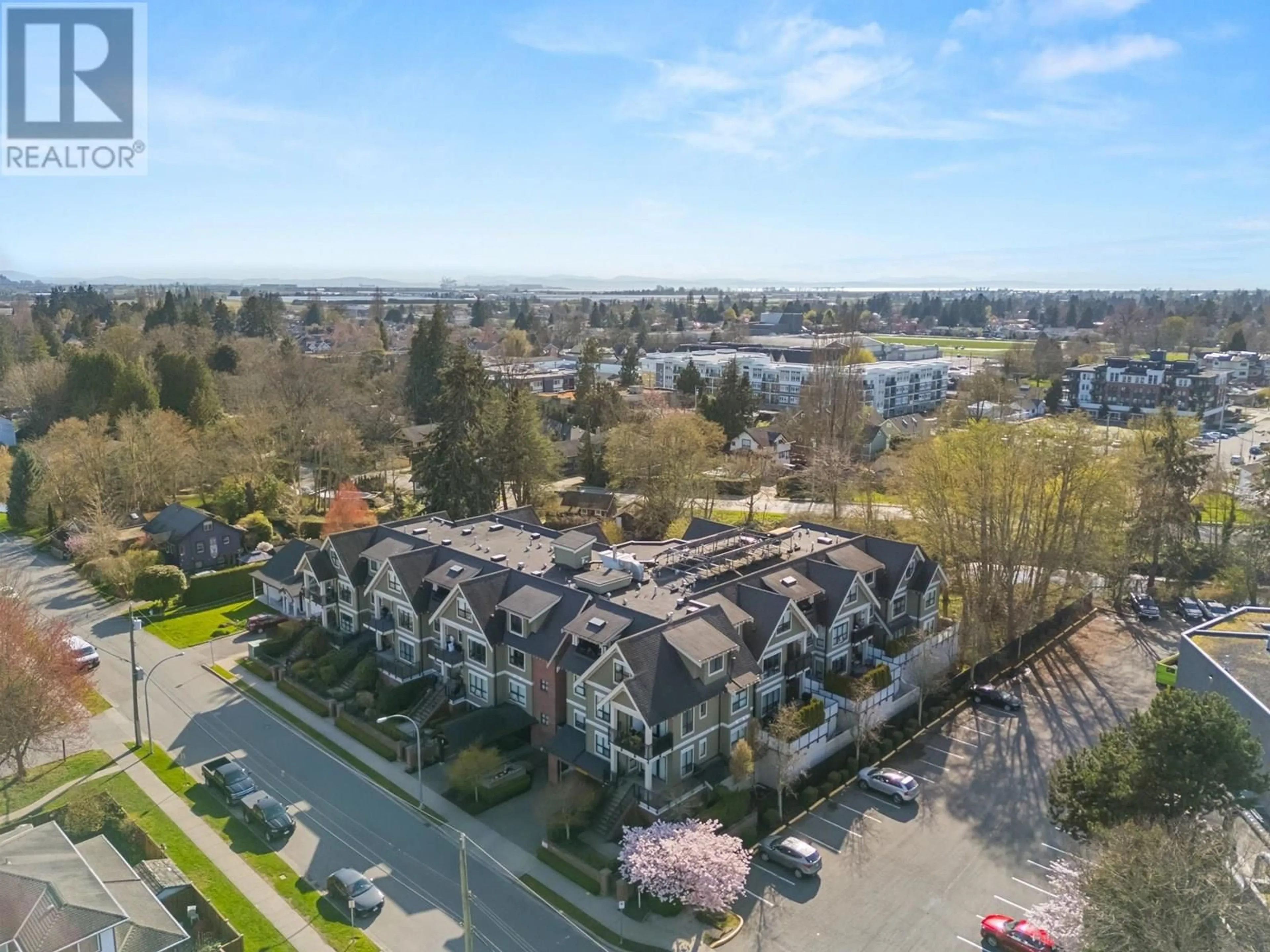 A pic from outside/outdoor area/front of a property/back of a property/a pic from drone, unknown for 408 - 4689 52A STREET, Ladner British Columbia V4K2Y7
