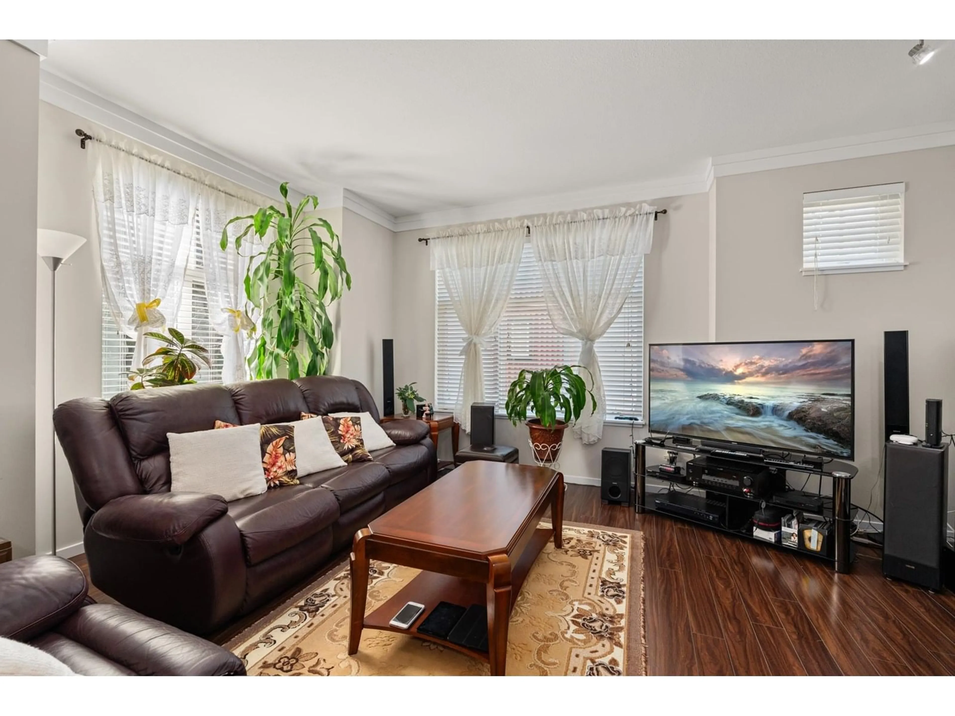 Living room with furniture, wood/laminate floor for 34 - 13886 62, Surrey British Columbia V3X0G2