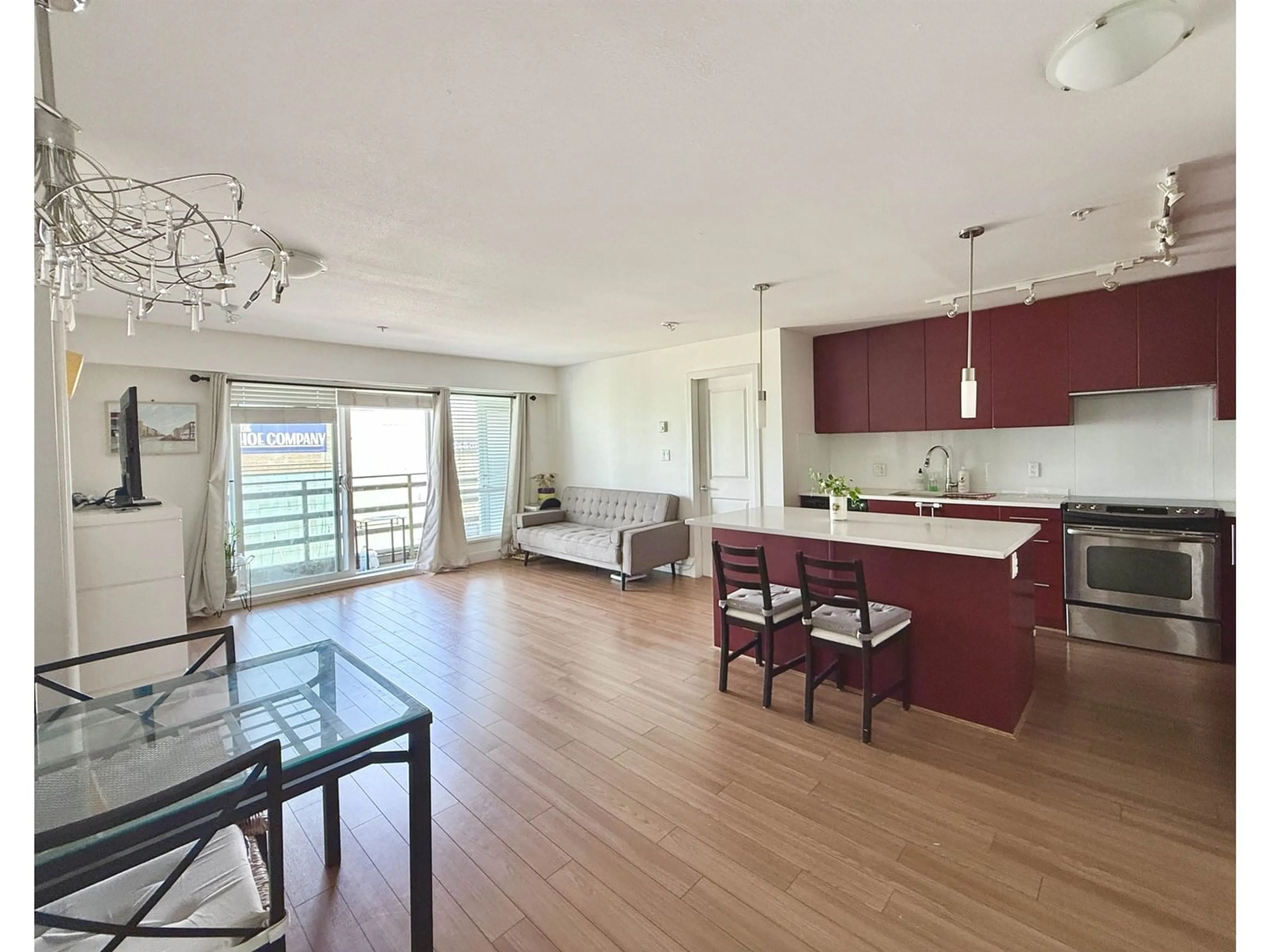 Open concept kitchen, wood/laminate floor for 205 - 15745 CROYDON, Surrey British Columbia V3Z2L5