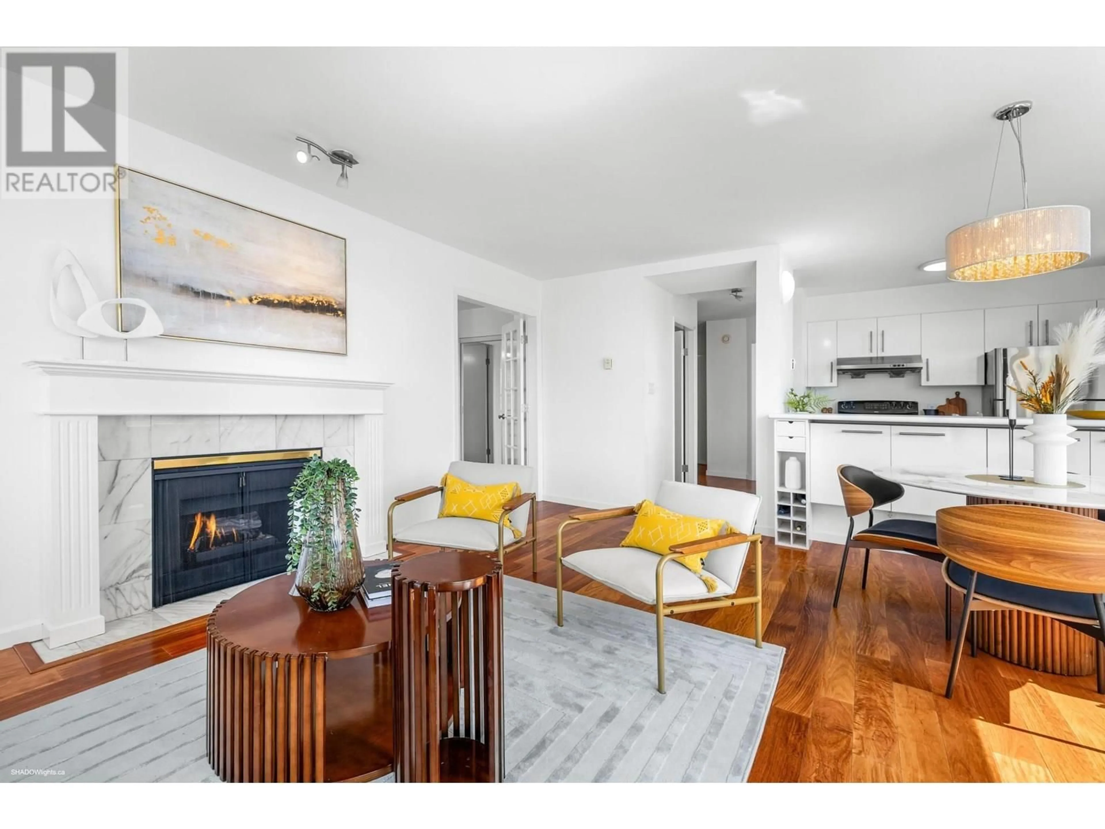 Living room with furniture, wood/laminate floor for 702 - 1436 HARWOOD STREET, Vancouver British Columbia V6G1X5