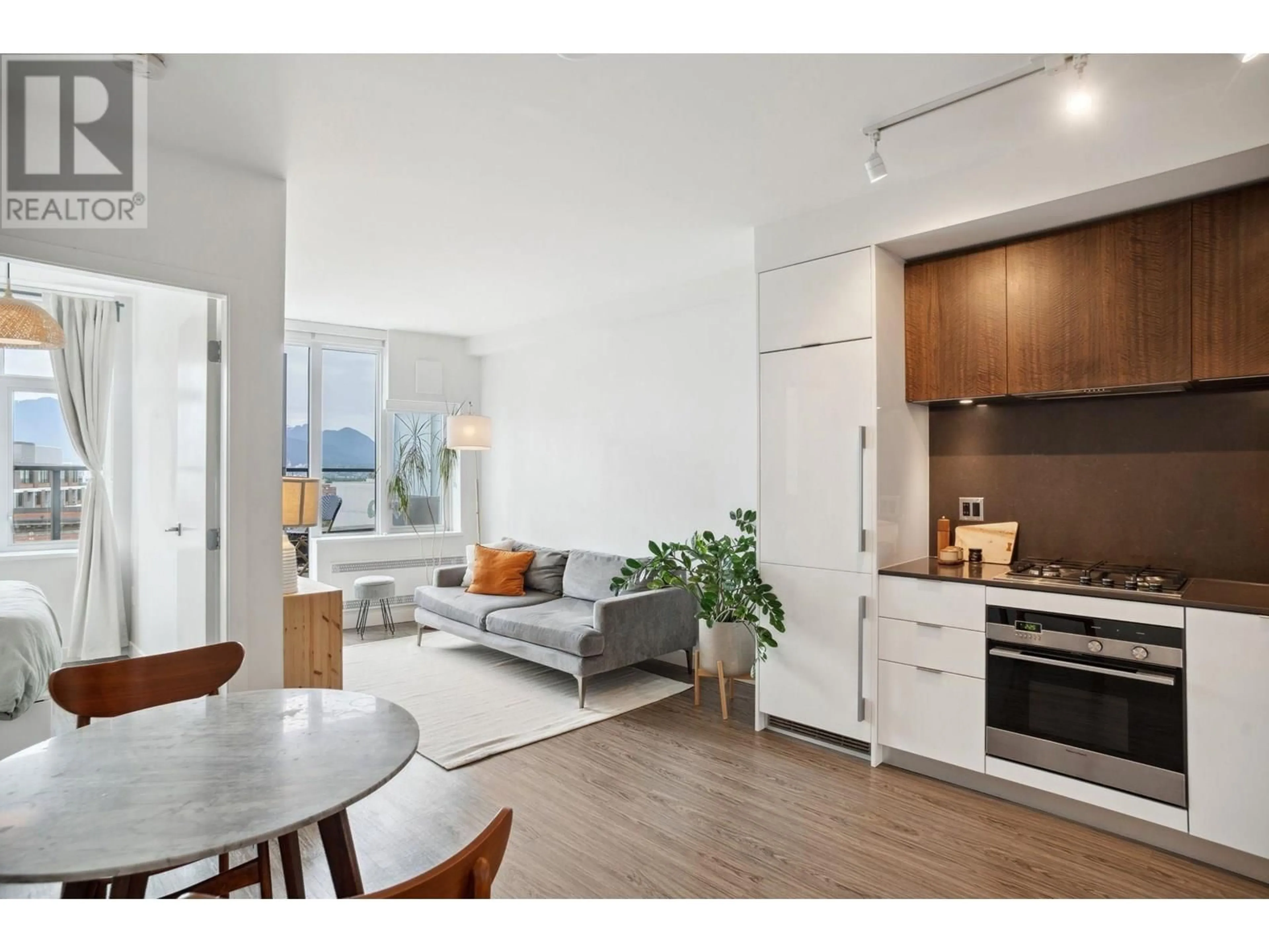 Open concept kitchen, wood/laminate floor for 504 - 209 7TH AVENUE, Vancouver British Columbia V5T0H3