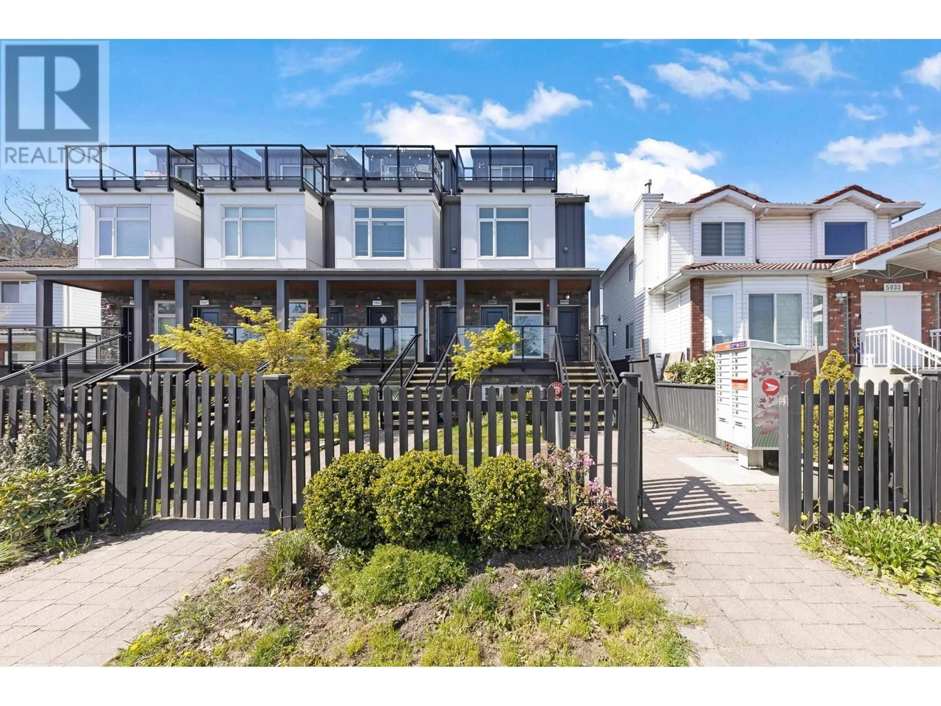 A pic from outside/outdoor area/front of a property/back of a property/a pic from drone, street for 5055 EARLES STREET, Vancouver British Columbia V5R3R8