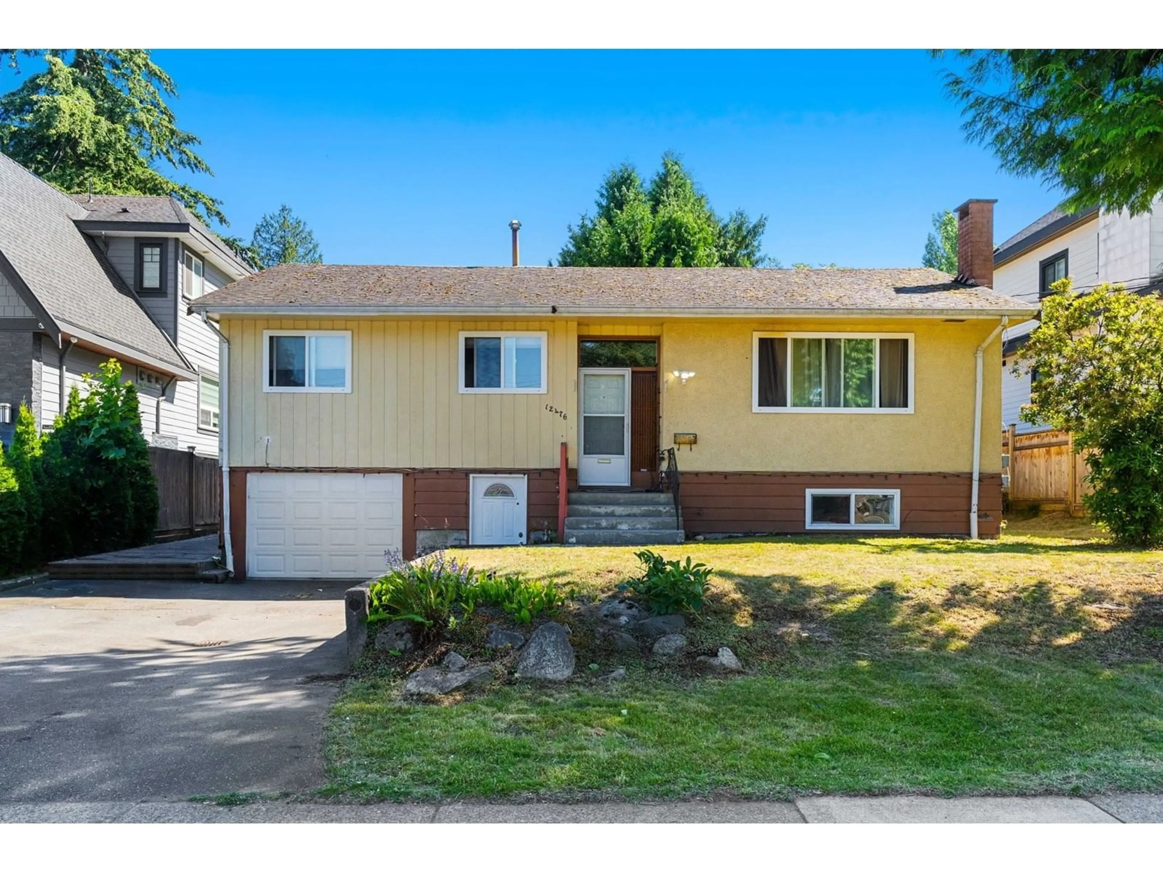 Home with vinyl exterior material, street for 12476 99, Surrey British Columbia V3V2P3