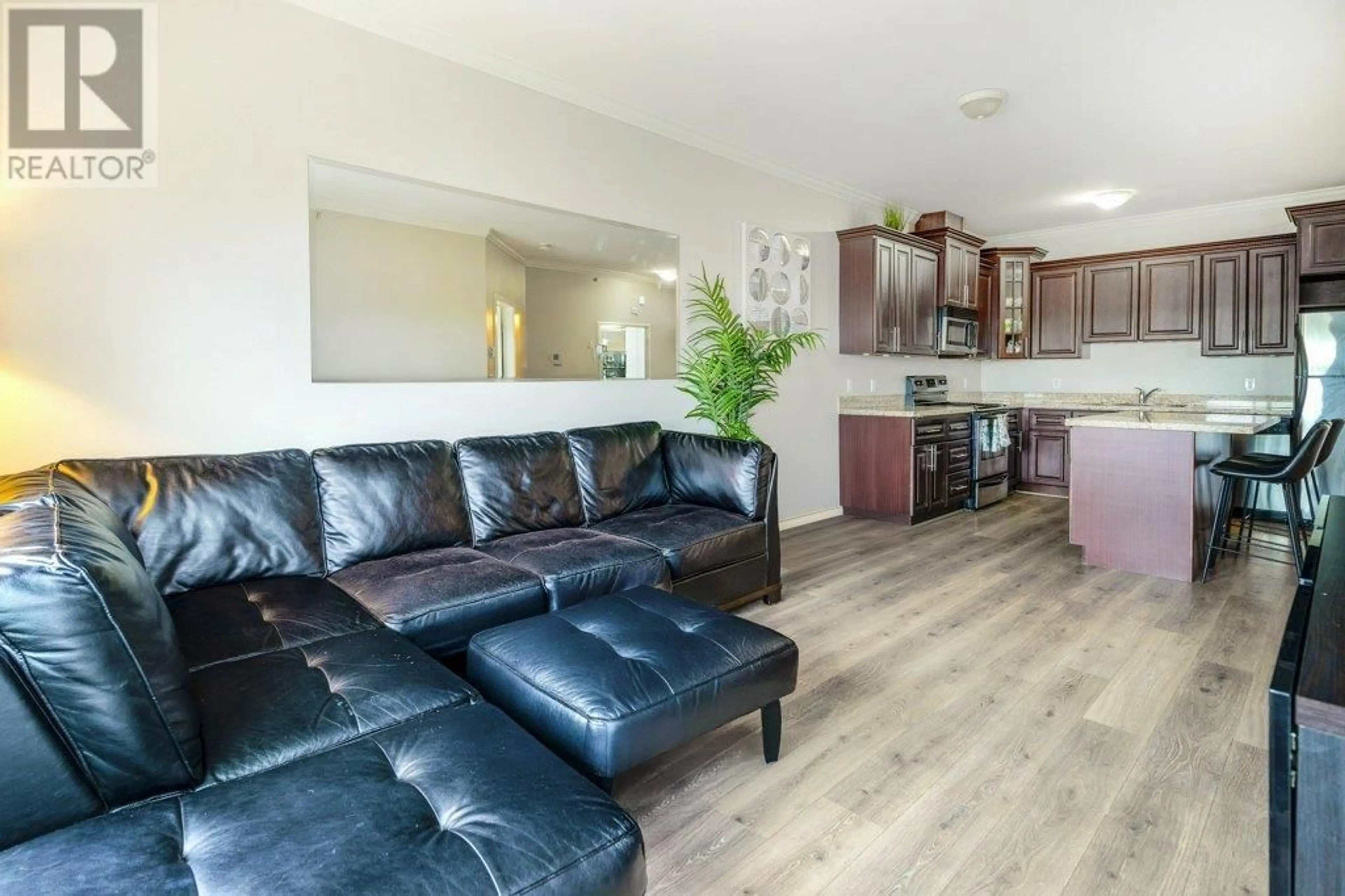 Living room with furniture, wood/laminate floor for 401 - 22363 SELKIRK AVENUE, Maple Ridge British Columbia V2X2X6