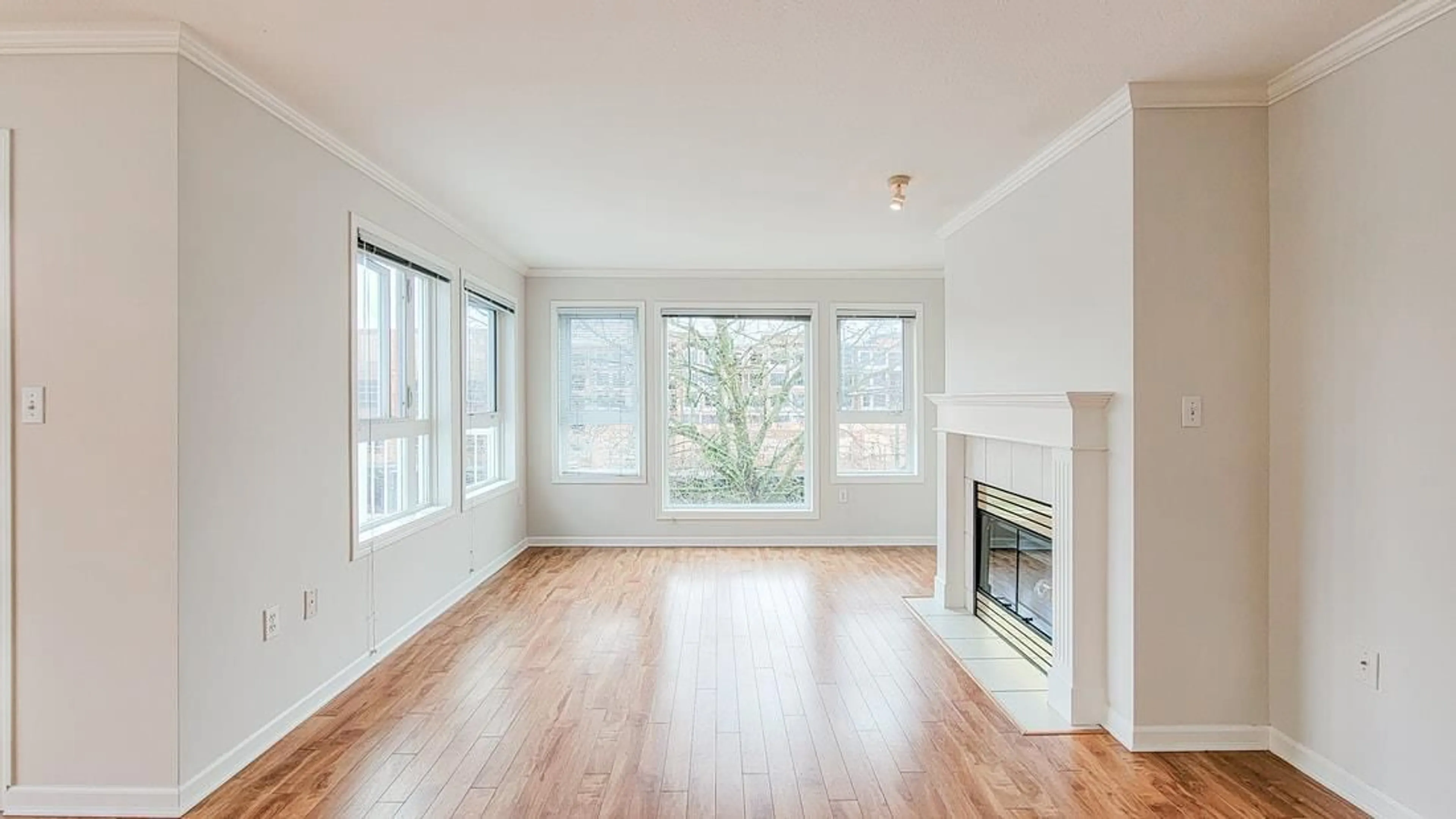 Living room with furniture, wood/laminate floor for 302 - 17727 58, Surrey British Columbia V3S1L5