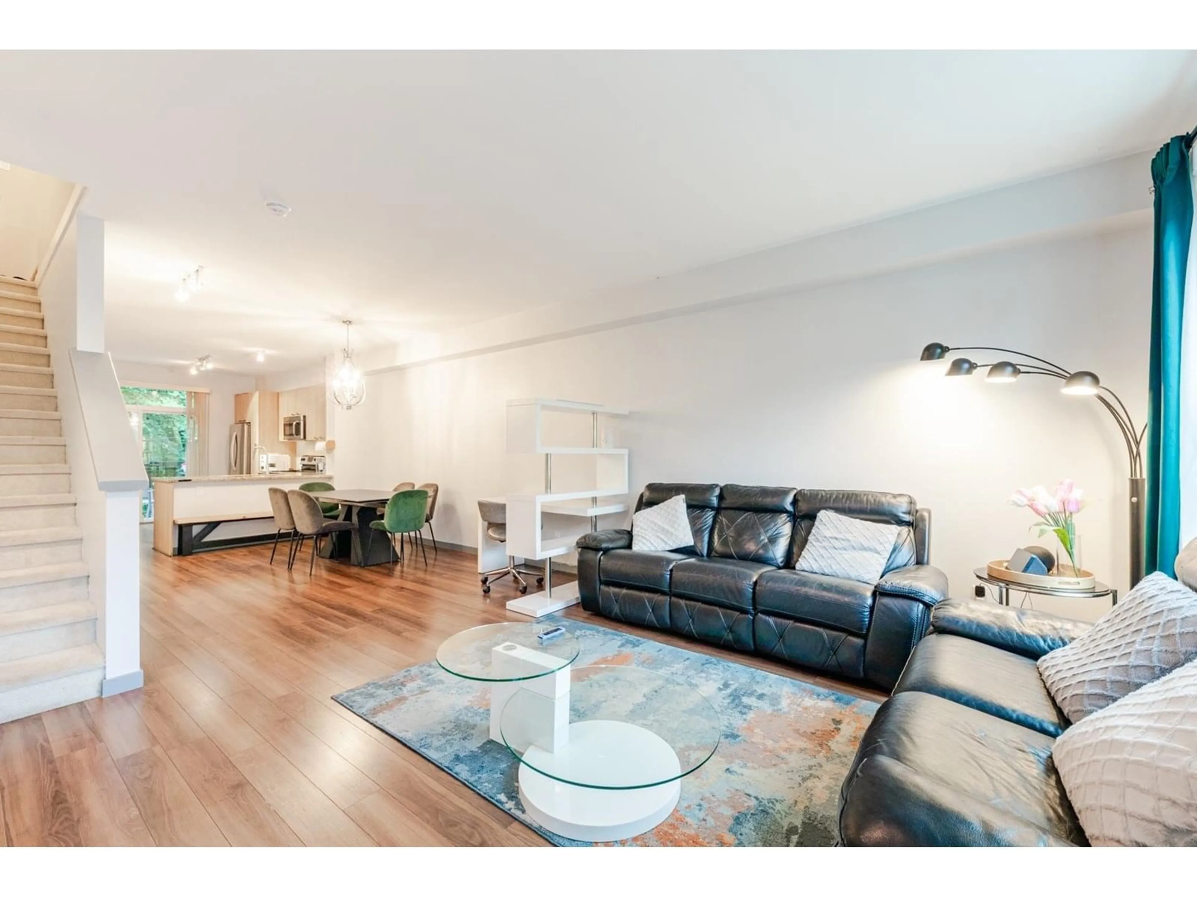 Living room with furniture, wood/laminate floor for 142 - 14833 61, Surrey British Columbia V3S6T6