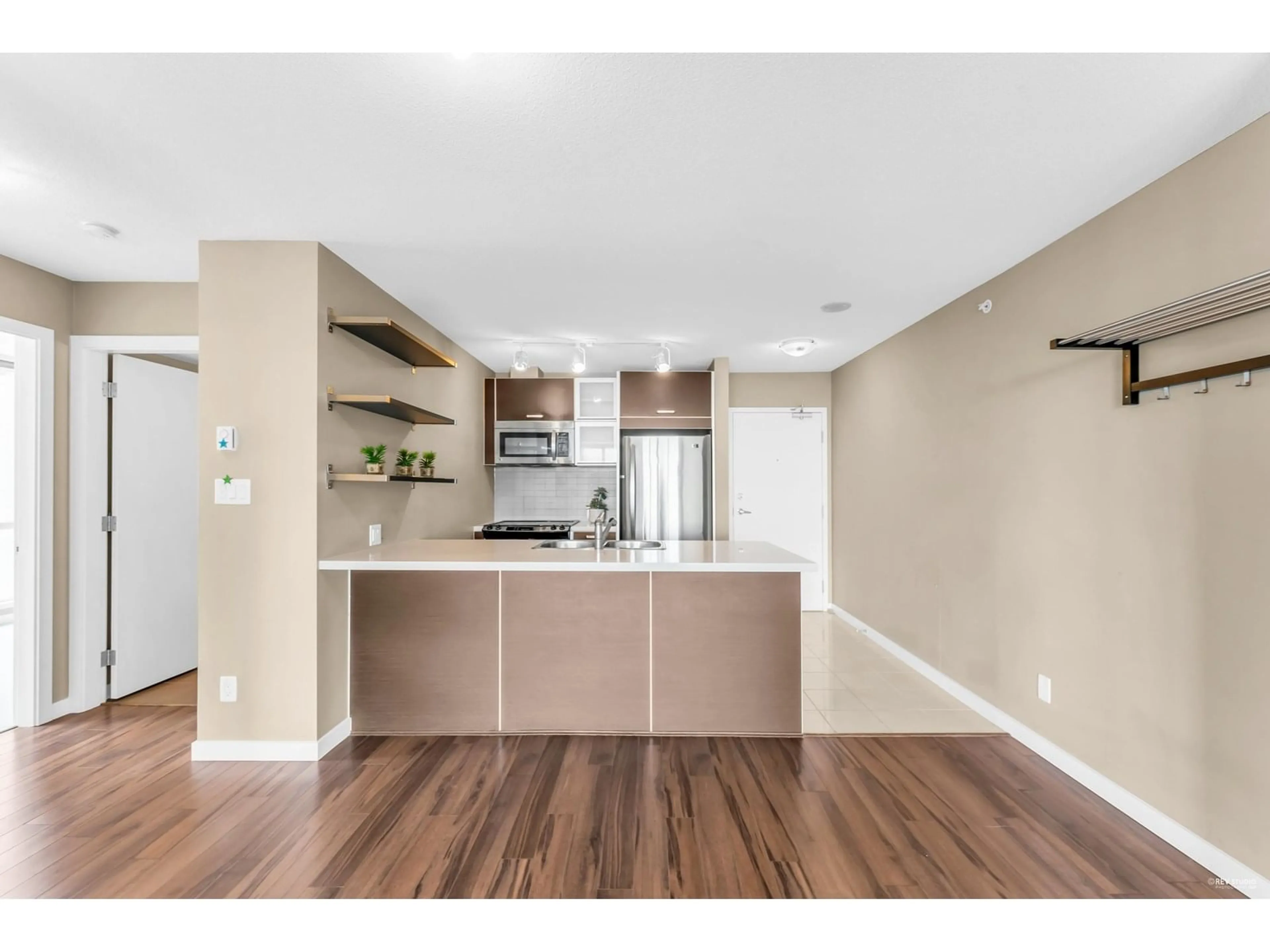 Open concept kitchen, wood/laminate floor for 2909 - 9981 WHALLEY, Surrey British Columbia V3T0H5