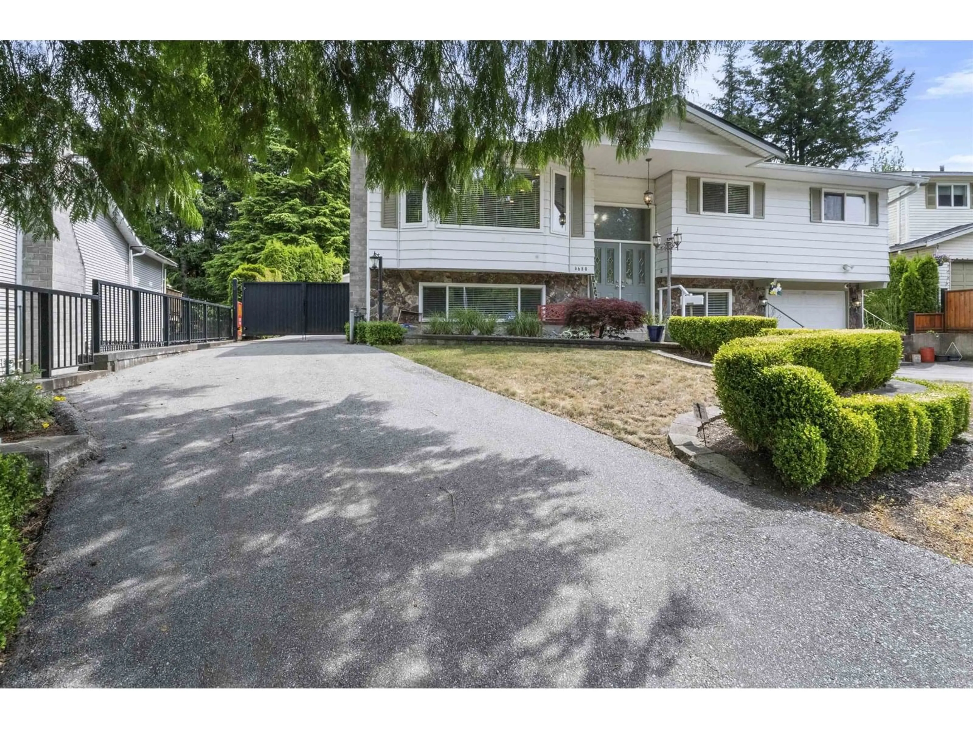 A pic from outside/outdoor area/front of a property/back of a property/a pic from drone, street for 4680 202, Langley British Columbia V3A5J3