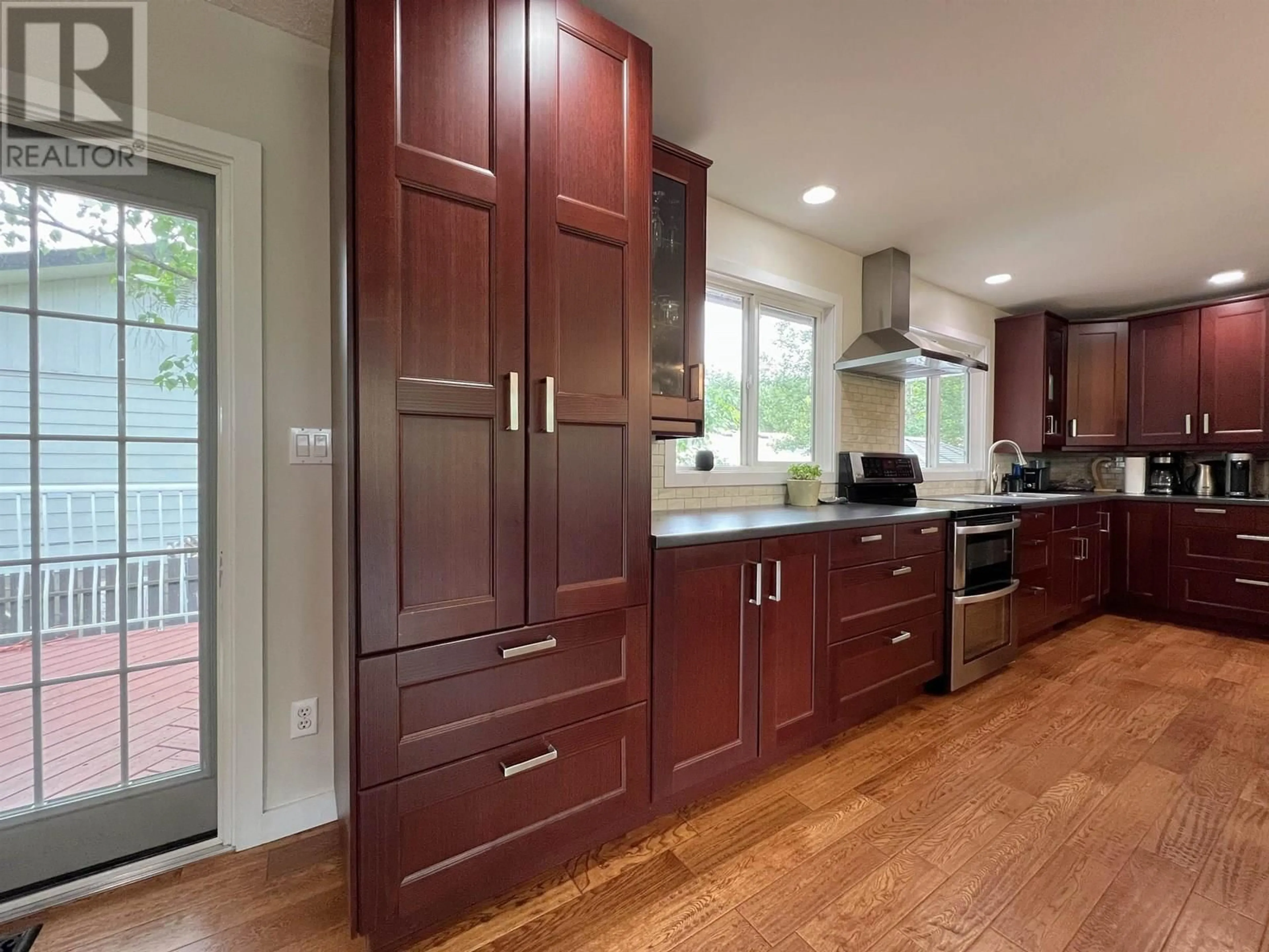 Contemporary kitchen, wood/laminate floor for 4129 22ND AVENUE, Prince George British Columbia V2N3N3