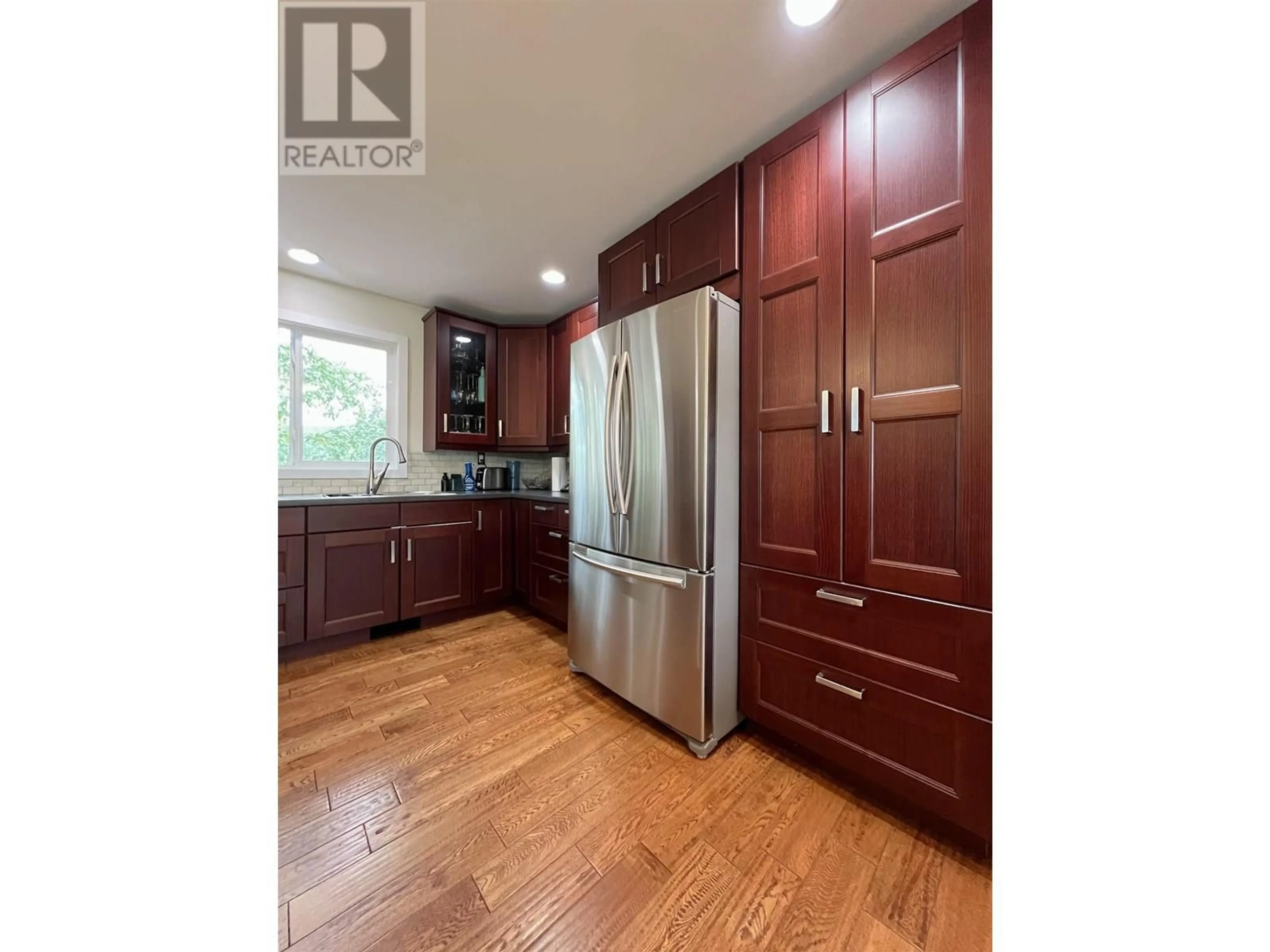 Open concept kitchen, wood/laminate floor for 4129 22ND AVENUE, Prince George British Columbia V2N3N3