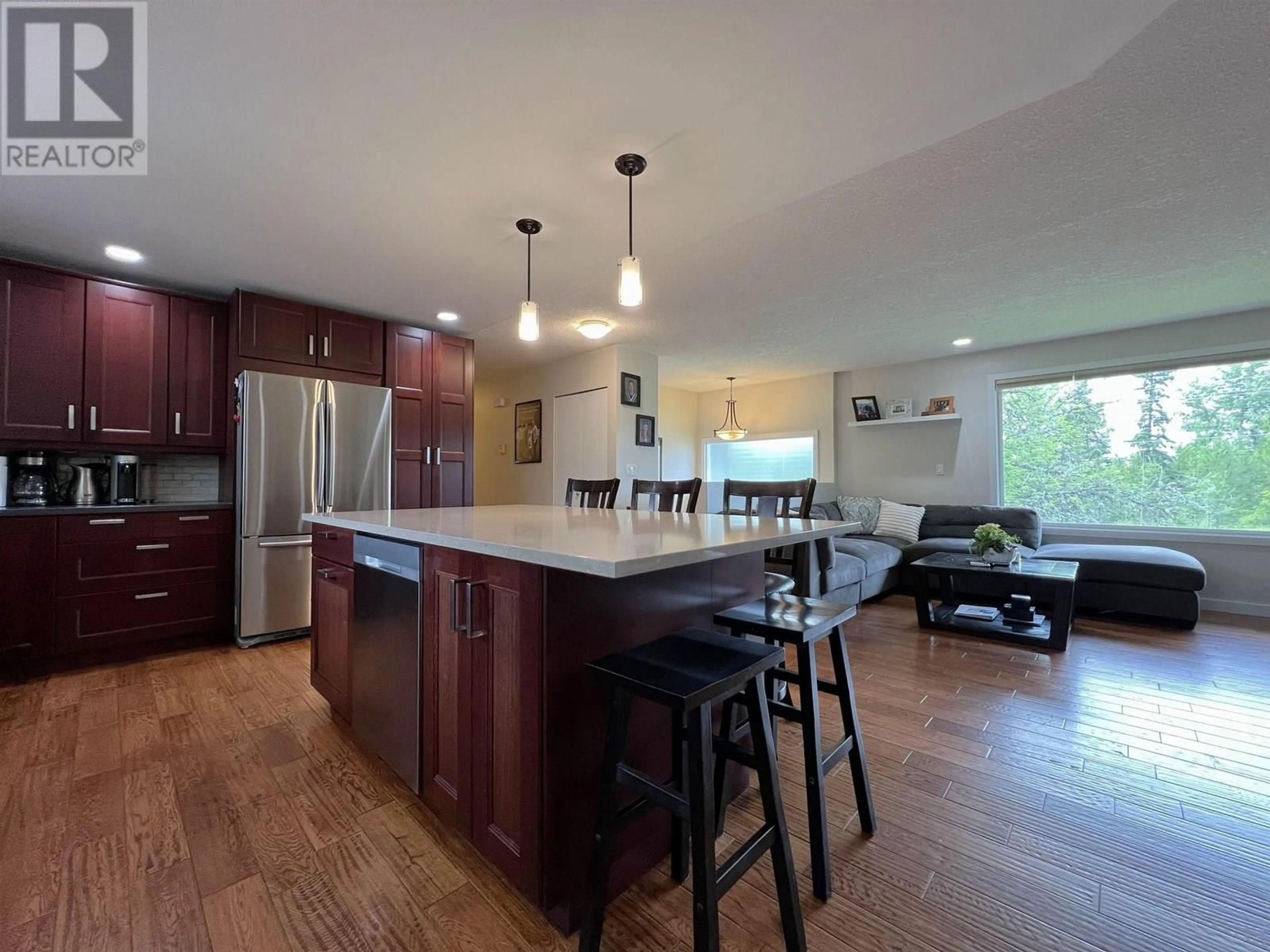 Open concept kitchen, wood/laminate floor for 4129 22ND AVENUE, Prince George British Columbia V2N3N3