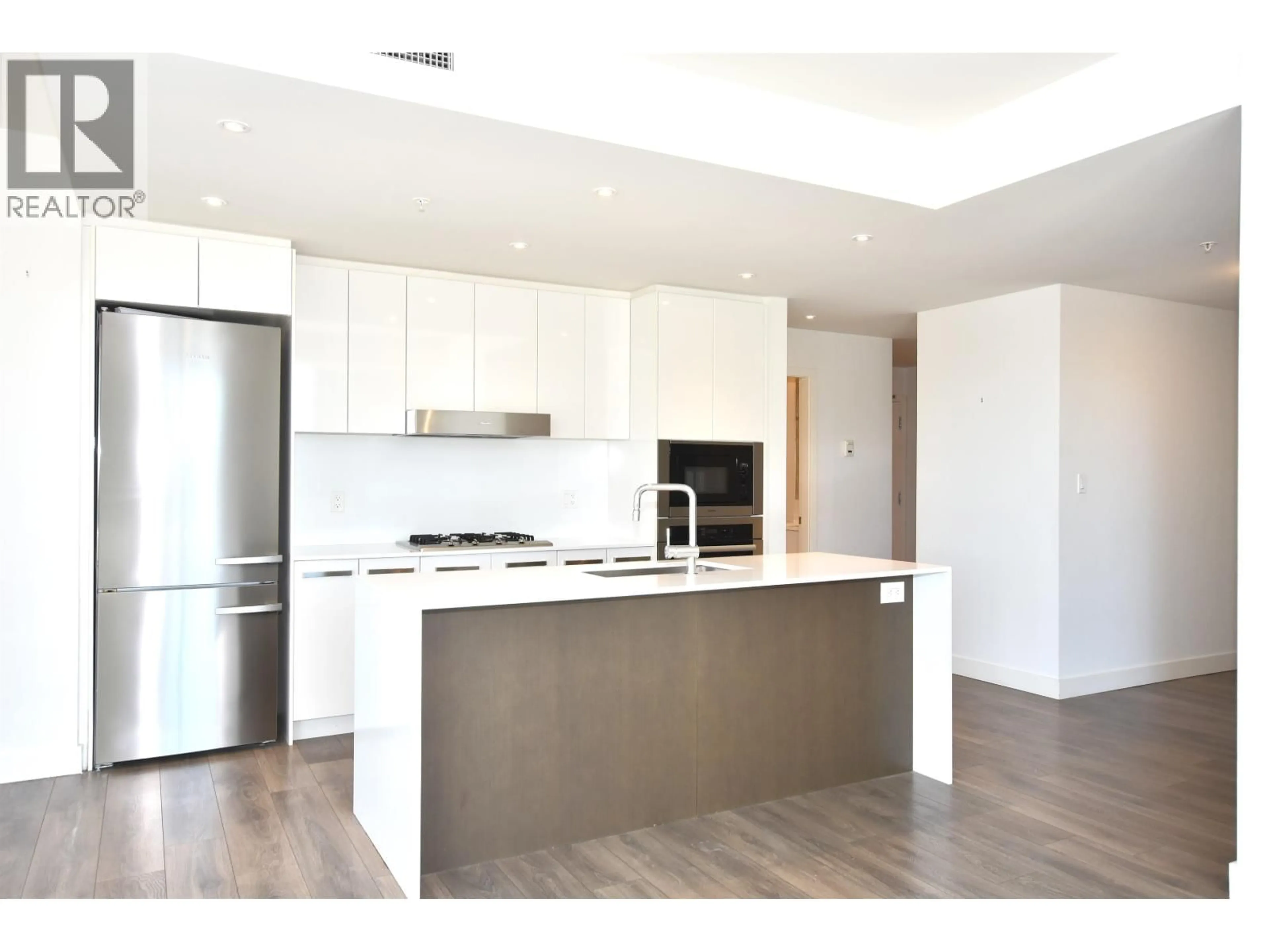 Open concept kitchen, wood/laminate floor for 307 - 5688 WILLOW STREET, Vancouver British Columbia V5Z3S4