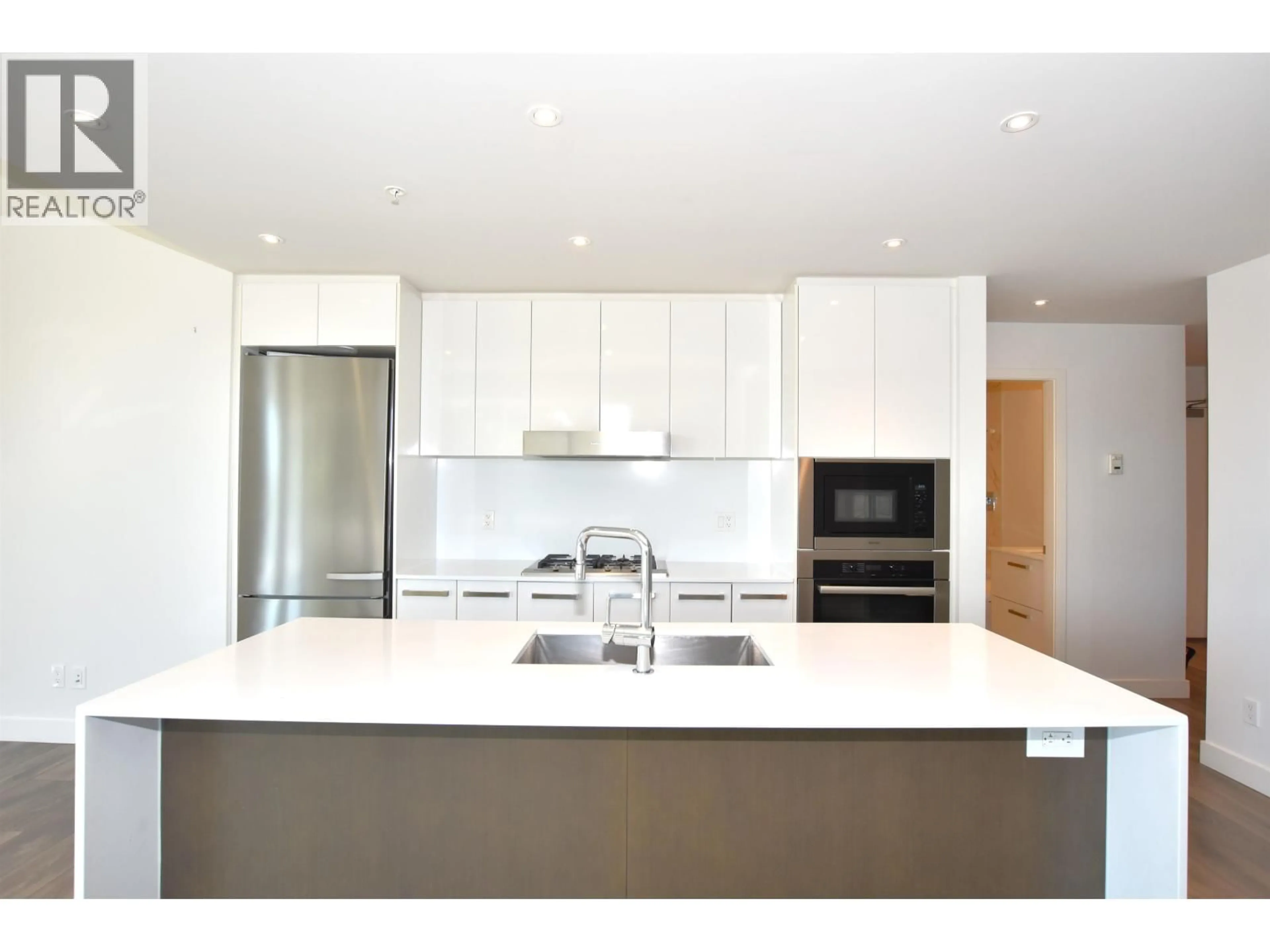 Contemporary kitchen, wood/laminate floor for 307 - 5688 WILLOW STREET, Vancouver British Columbia V5Z3S4