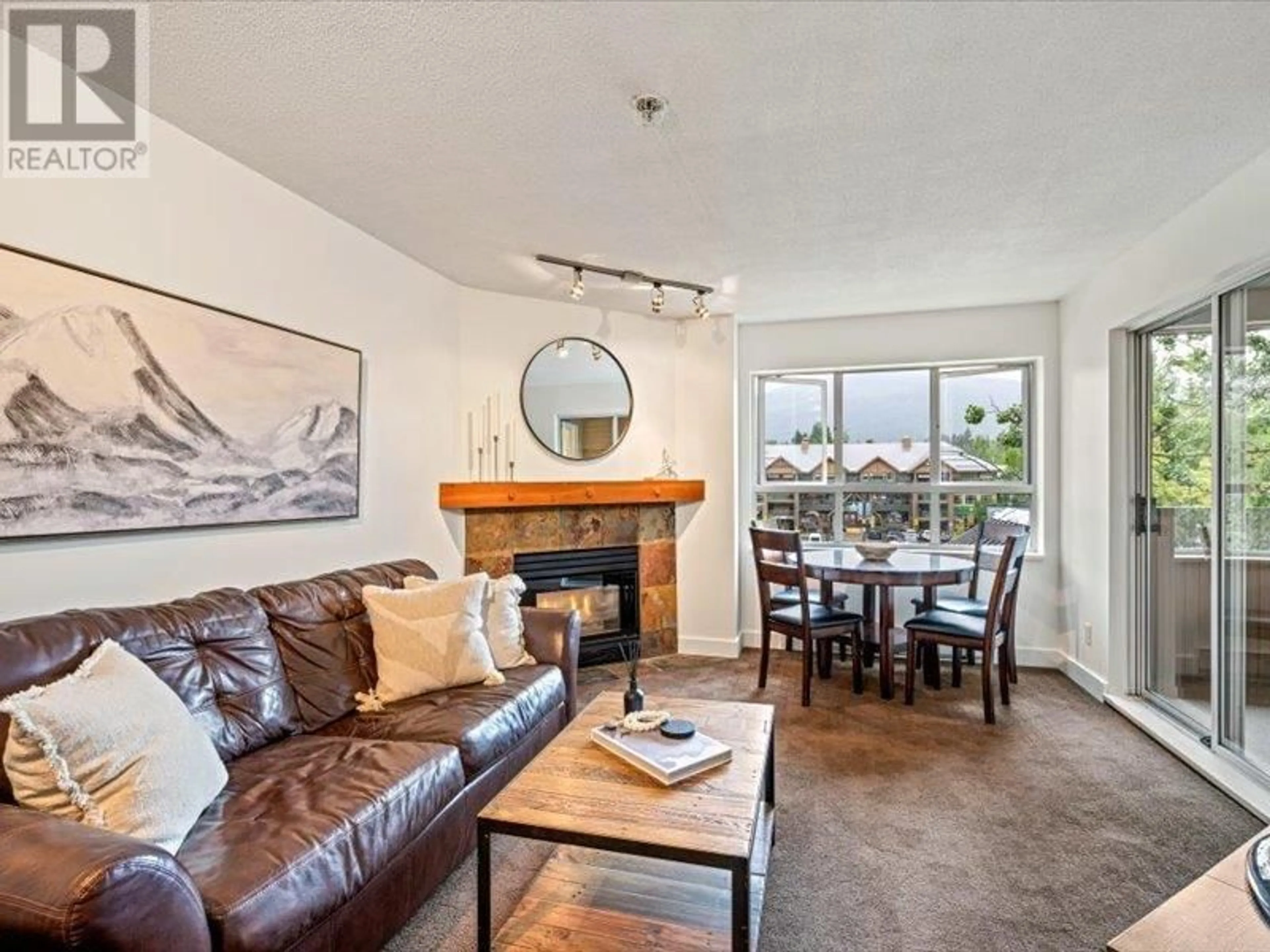 Living room with furniture, wood/laminate floor for 240 - 4350 LORIMER ROAD, Whistler British Columbia V8E1A5