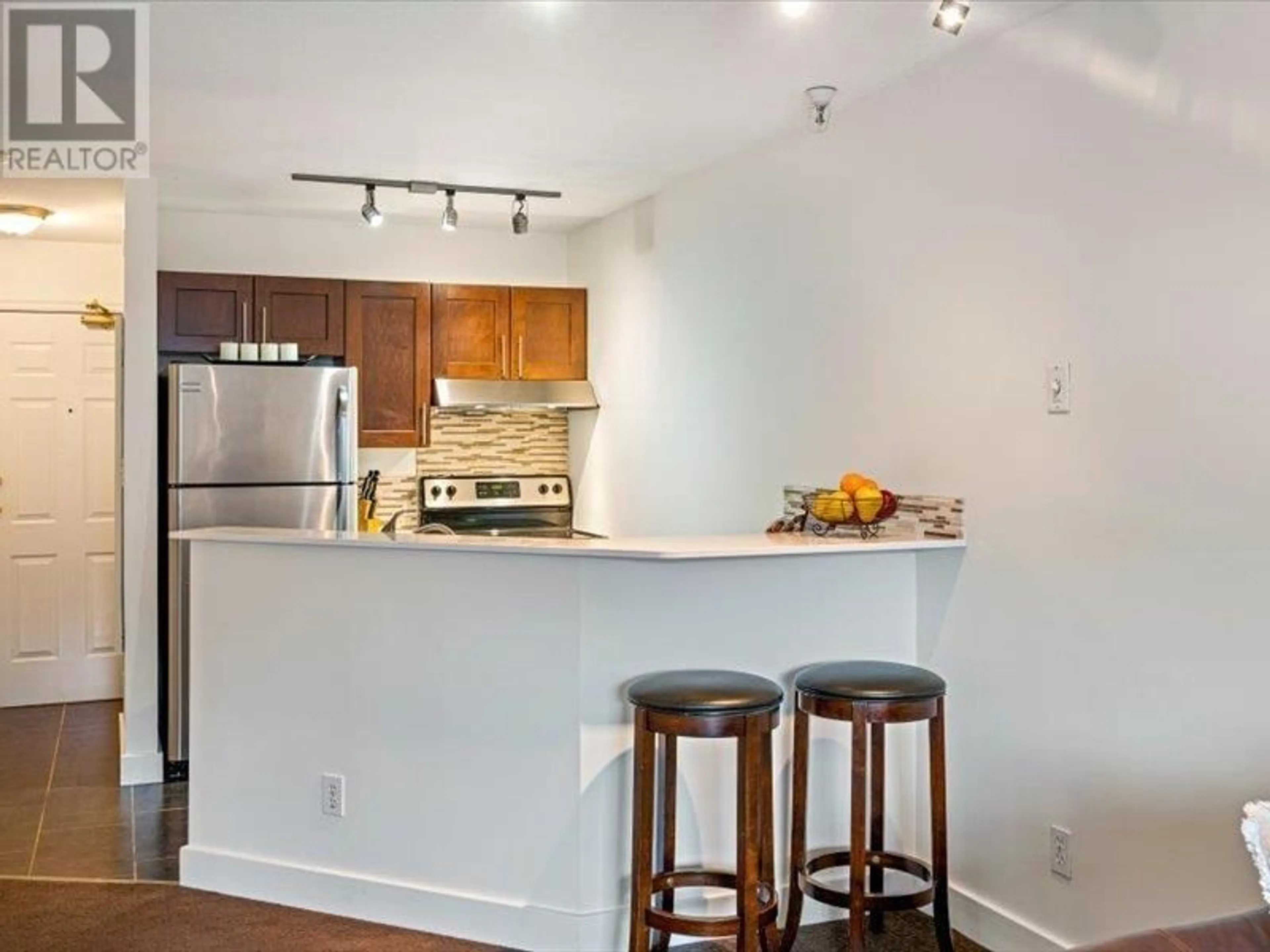 Open concept kitchen, wood/laminate floor for 240 - 4350 LORIMER ROAD, Whistler British Columbia V8E1A5