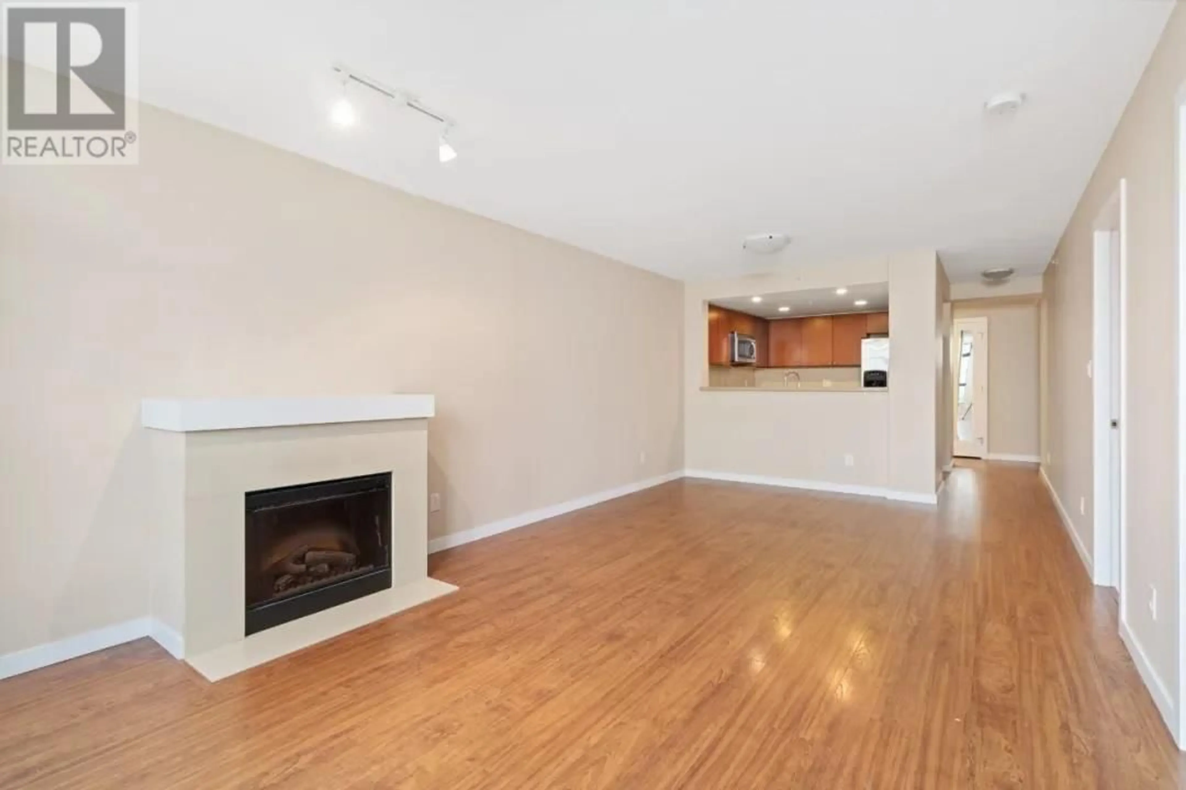 Living room with furniture, wood/laminate floor for 608 - 8120 LANSDOWNE ROAD, Richmond British Columbia V6X0A1