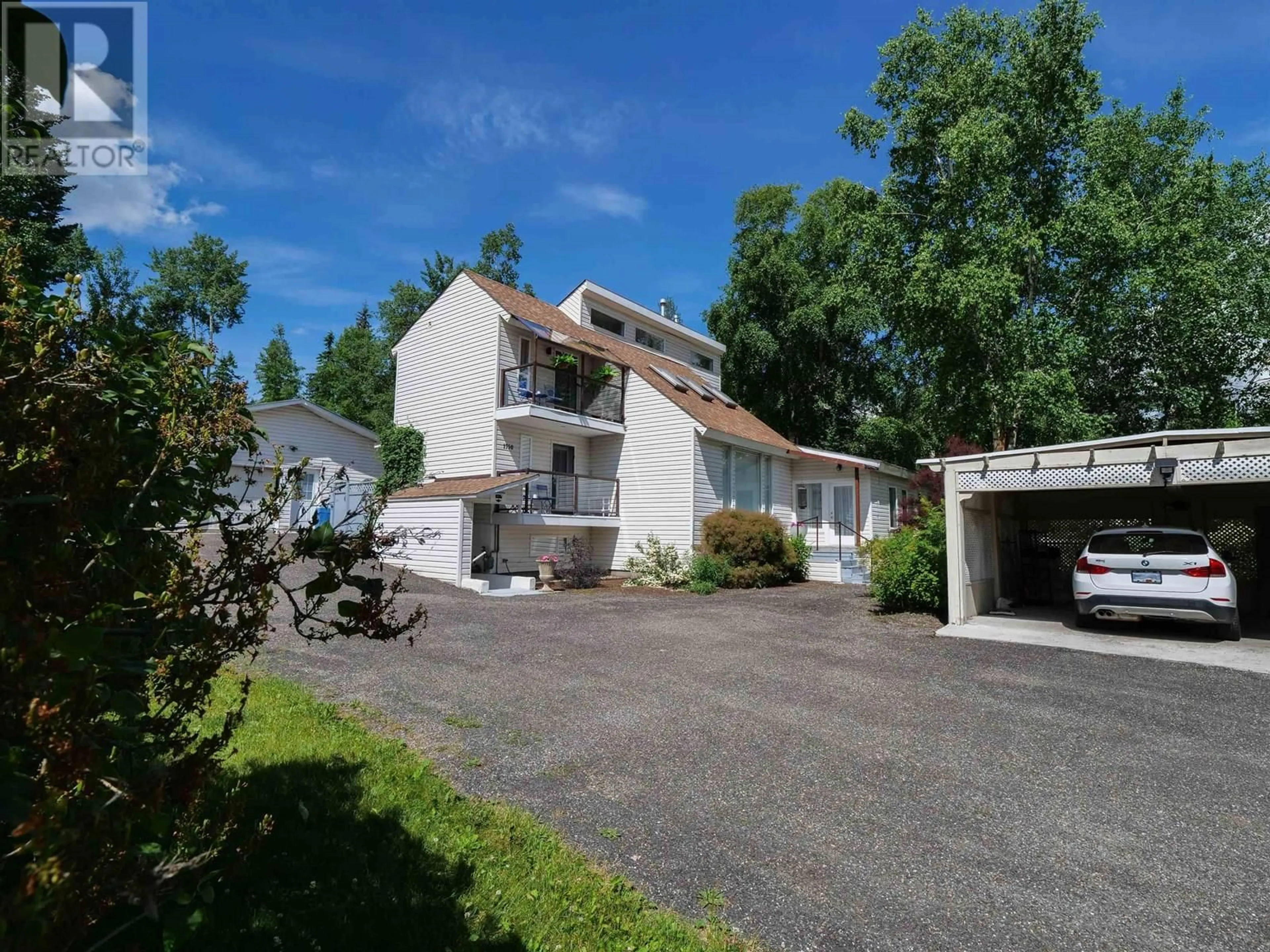A pic from outside/outdoor area/front of a property/back of a property/a pic from drone, street for 1750 BEACH CRESCENT, Quesnel British Columbia V2J4J6