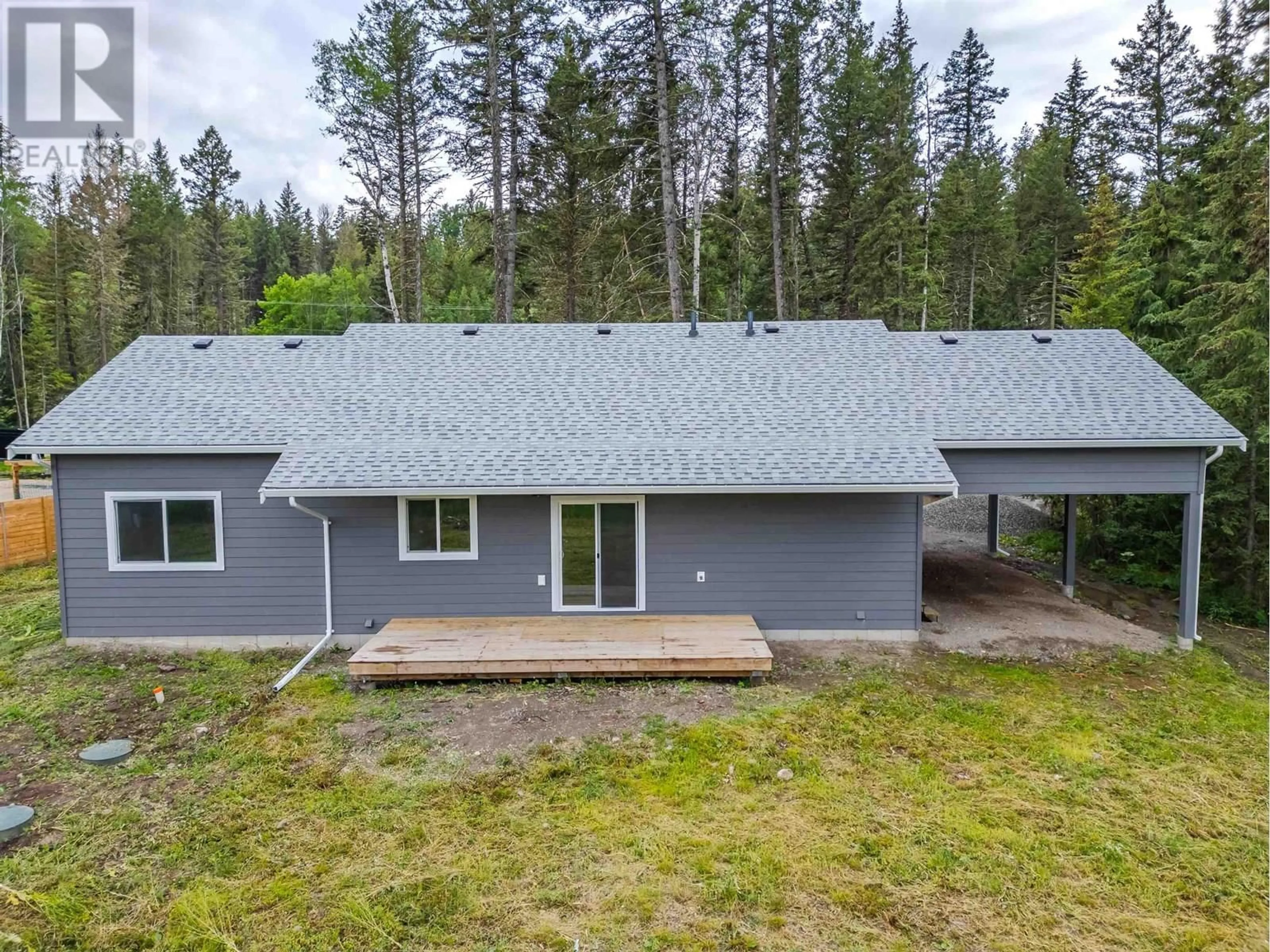 A pic from outside/outdoor area/front of a property/back of a property/a pic from drone, forest/trees view for 5365 KALLUM DRIVE, 108 Mile Ranch British Columbia V0K2Z0
