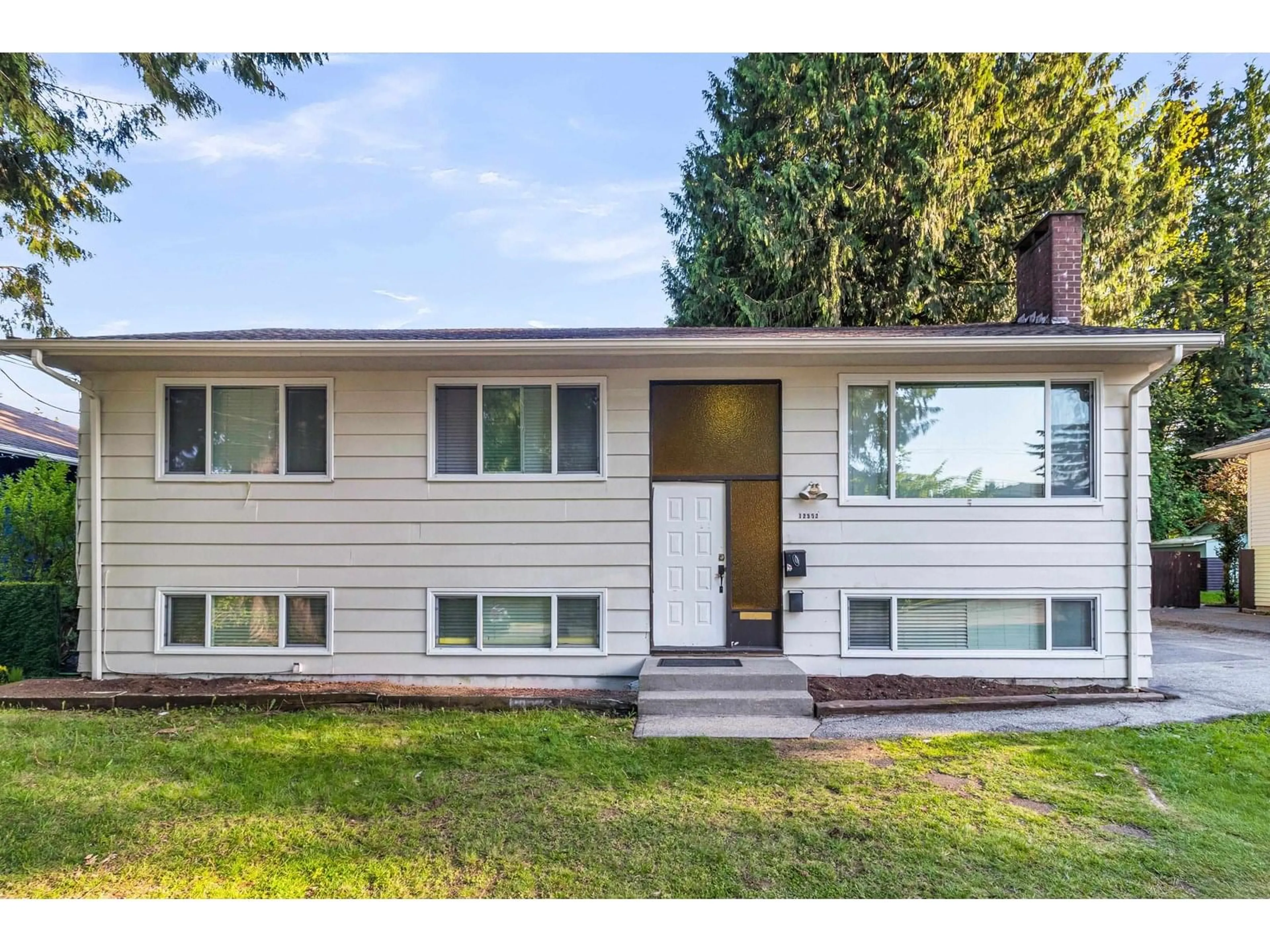 Home with vinyl exterior material, street for 12552 99, Surrey British Columbia V3V2P5