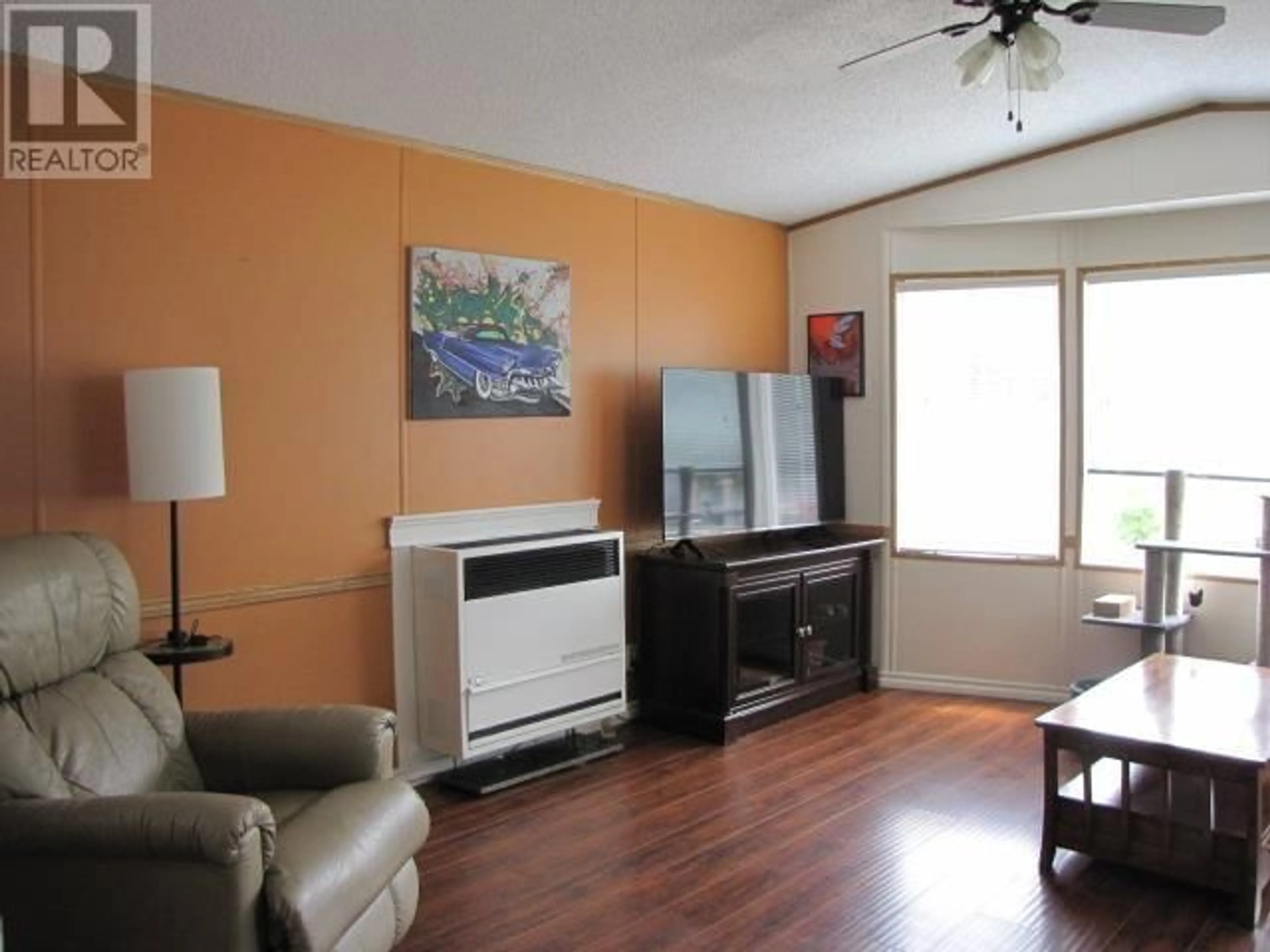 Living room with furniture, wood/laminate floor for 4271 CLEAR ROAD, Williams Lake British Columbia V2G5A1