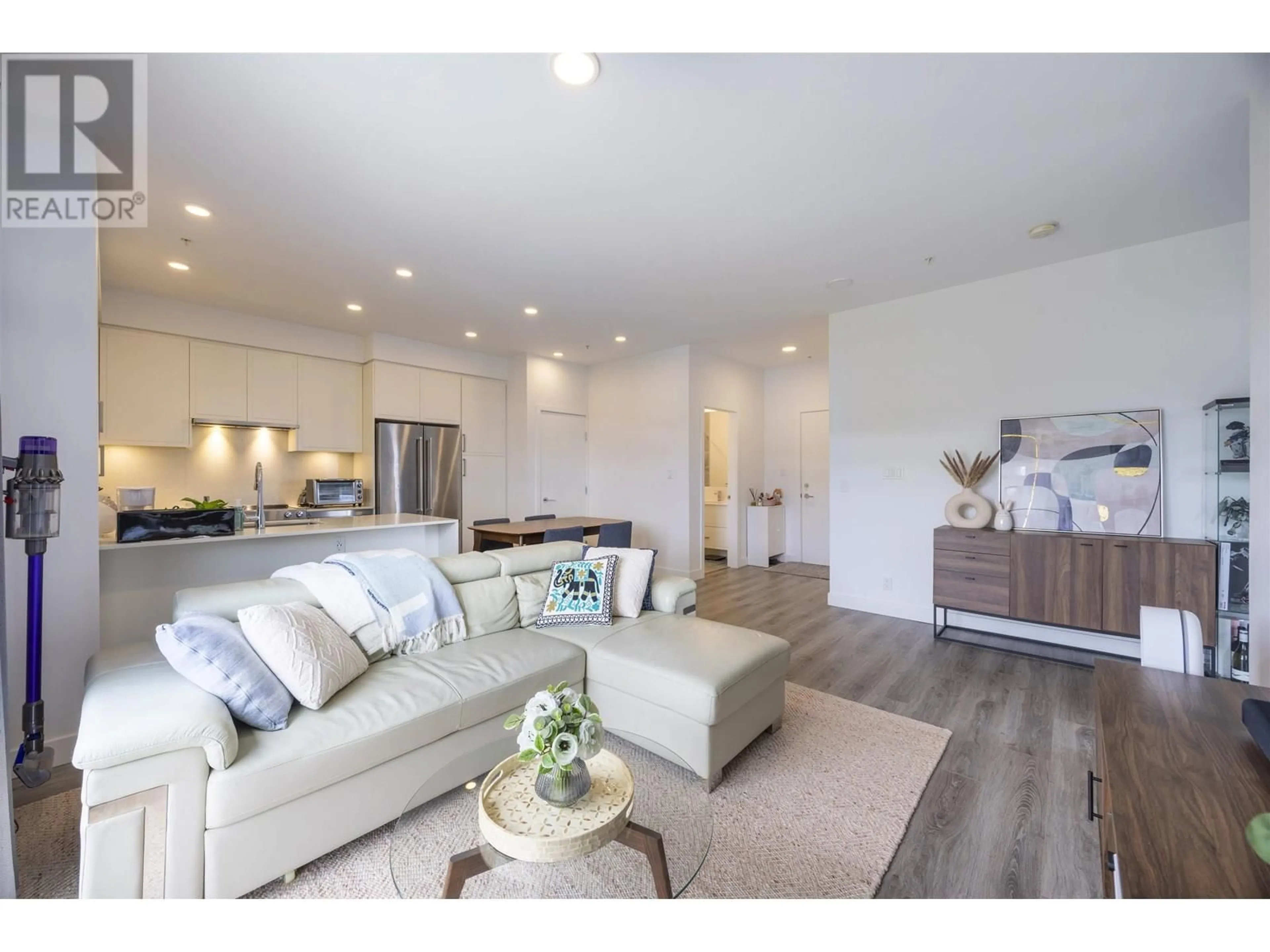 Open concept kitchen, wood/laminate floor for 606 - 700 CLARKE ROAD, Coquitlam British Columbia V3J0K5
