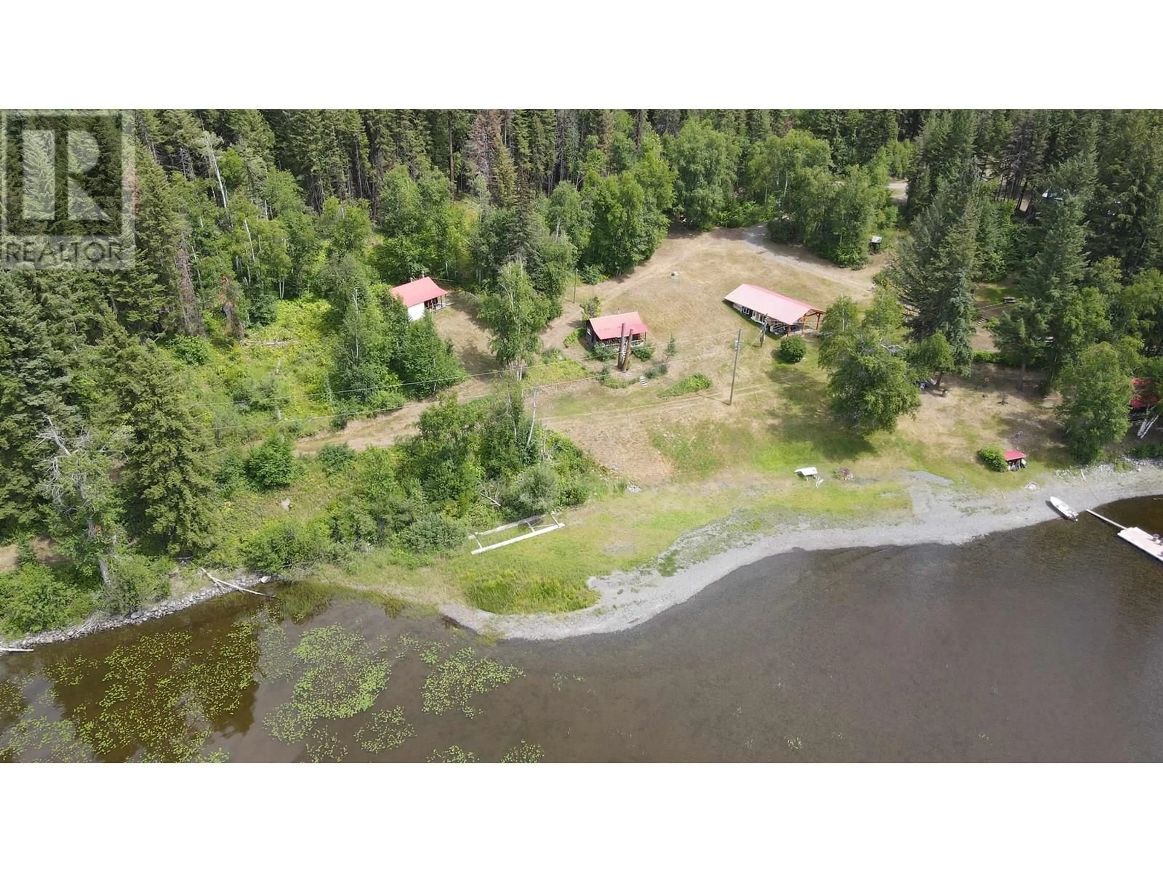 A pic from outside/outdoor area/front of a property/back of a property/a pic from drone, water/lake/river/ocean view for 7582 RESORT ROAD, Canim Lake British Columbia V0K1L0
