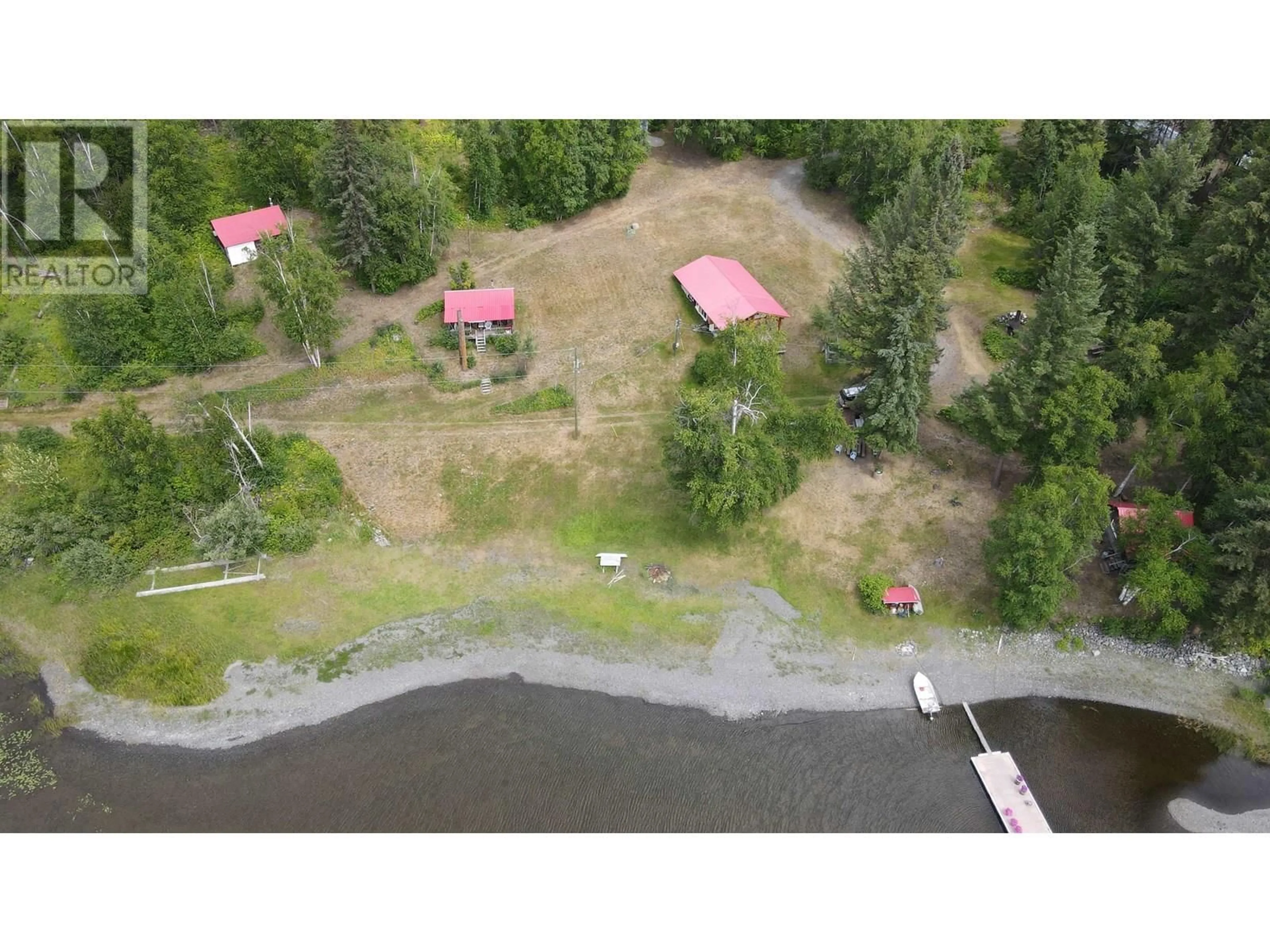 A pic from outside/outdoor area/front of a property/back of a property/a pic from drone, water/lake/river/ocean view for 7582 RESORT ROAD, Canim Lake British Columbia V0K1L0