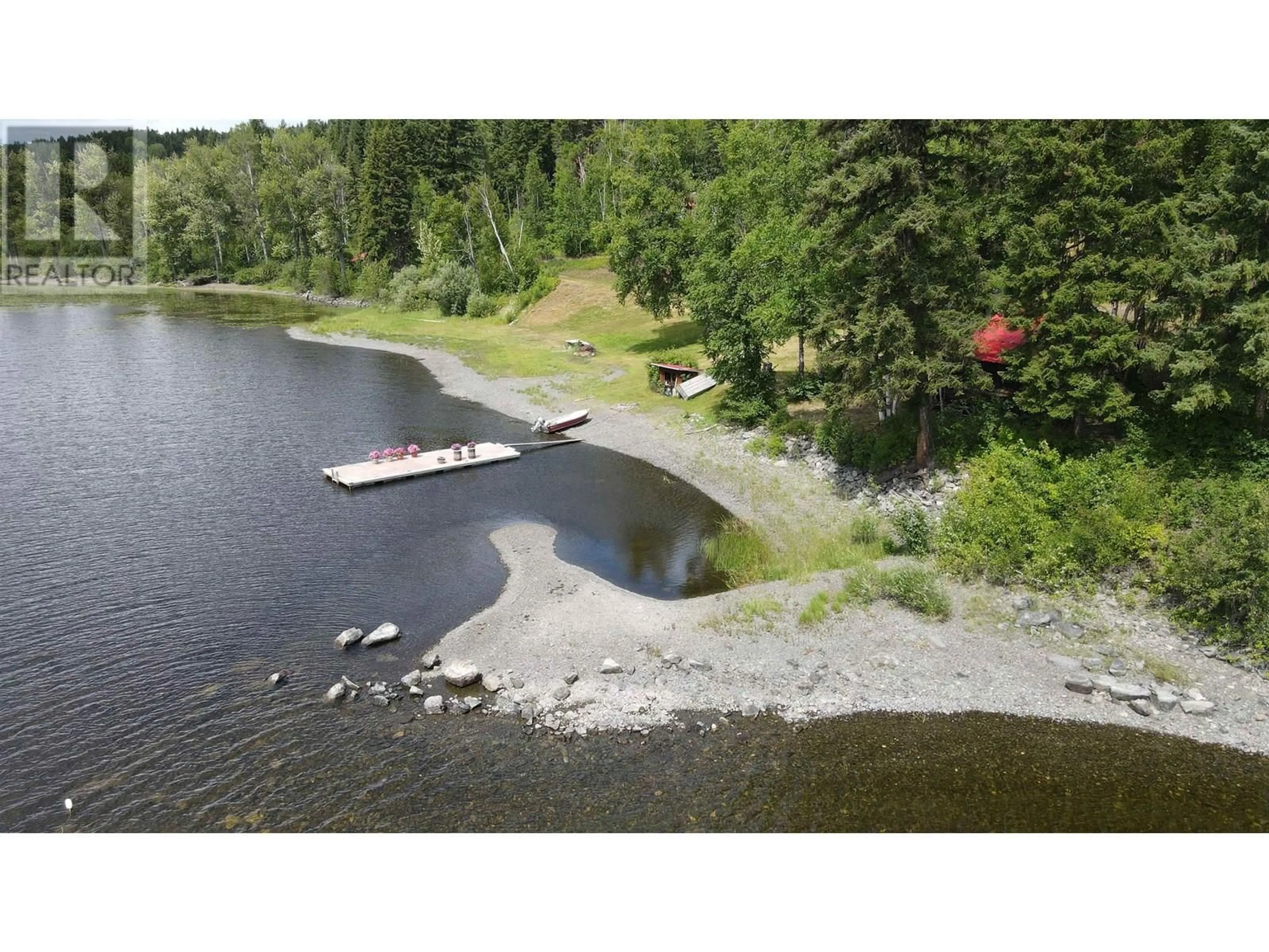 A pic from outside/outdoor area/front of a property/back of a property/a pic from drone, water/lake/river/ocean view for 7582 RESORT ROAD, Canim Lake British Columbia V0K1L0